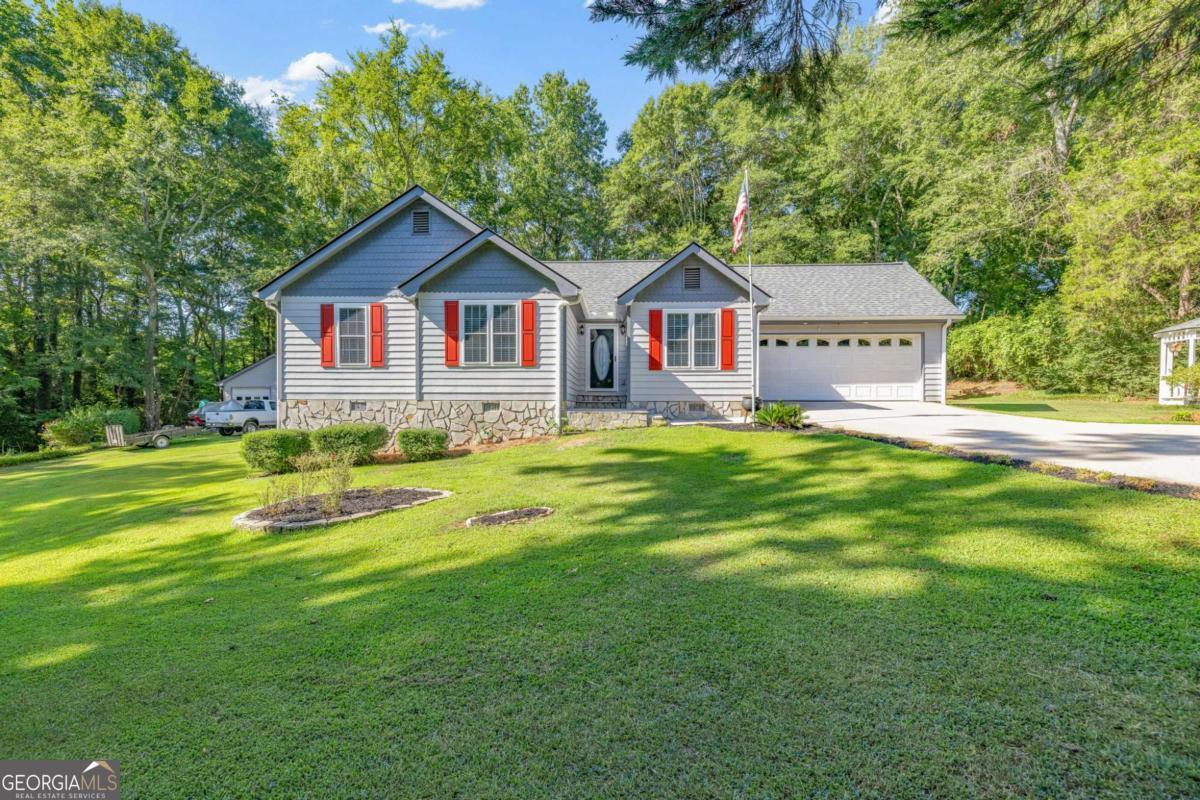 Nestled on 1.72 acres with no HOA, this immaculately maintained Ranch Home offers privacy, charm and true move-in readiness. Surrounded by mature trees and beautifully landscaped grounds, you'll be captivated by the serene setting featuring a manicured lawn, professional landscaping, and a charming gazebo - all setting the tone for a home that clearly reflects thoughtful care and pride of ownership. This 3BD/2BA home offers inviting warmth and timeless appeal, featuring spacious bedrooms, hardwood floors, fresh interior paint, and a layout that flows effortlessly. Enjoy meals in the eat-in kitchen with crisp white cabinetry, white appliances, a modern backsplash, and a new dishwasher, or entertain in the formal dining room and expansive family room with plenty of space to gather and relax. Both bathrooms have been fully updated with modern tile, fresh cabinetry, new fixtures, and designer finishes. New roof on home, detached garage, and gazebo. Shed offers additional storage. Don't miss the chance to own a truly special home where pride of ownership shines through every detail. Schedule your private showing today - homes like this don't come along often!