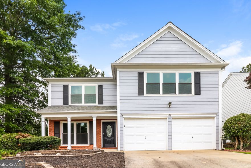 Welcome to your dream home, featuring three spacious bedrooms and 2.5 bathrooms! This open-concept residence boasts a den highlighted by a majestic fireplace and floods of natural light, enhanced by renovated interiors. The kitchen has been upgraded with custom cabinets, granite countertops, an exquisite backsplash, and stainless steel appliances. Enjoy the convenience of a large laundry room on the main level. Flooring updates includes hardwood on the lower level, plush new carpet on the upper level, and elegant tile in select areas. The backyard includes a walk-out patio, ideal for summer BBQs.