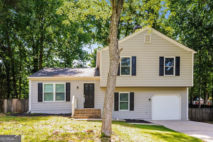 This lovely multi-story rental home in Alpharetta, Ga waits for you to take a tour. The open floor plan offers a spacious interior with plenty of room for decoration and relaxation. Relax in the living room, where the fireplace offers a nice touch and adds to the home's aesthetic. Prepare meals on the spacious countertops and in the sleek appliances in the kitchen. Crisp cabinets offer plenty of storage space. A separate laundry room provides additional space for storage. Dine under the chandelier in the dining room. From here, a set of double doors provides access to the deck and fenced yard outside. Upstairs, the main bedroom has a walk-in closet, and its bathroom has a walk-in shower.
