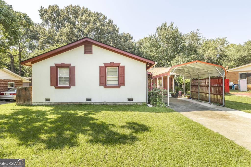 Welcome to a truly special property-a meticulously maintained, single-level brick home that exudes timeless charm and is ready for you to move right in. This classic residence, cared for by the same owner for 55 years, offers a blend of comfort and convenience that is hard to find. The inviting interior features three bedrooms and two full bathrooms, providing ample space for you and your guests. The updated kitchen is both functional and stylish, while two flexible living spaces offer endless possibilities for relaxation, entertaining, or a home office. Step outside to discover your private oasis. A large covered back porch overlooks a level, fenced backyard-the perfect setting for summer barbecues, a morning coffee, or a safe place for pets to play. Location is everything, and this home delivers. Situated in a highly convenient area, you'll be just moments away from a variety of shopping and dining establishments. Opportunities like this are rare. Don't miss your chance to create your own memories. Schedule your showing today before it's gone