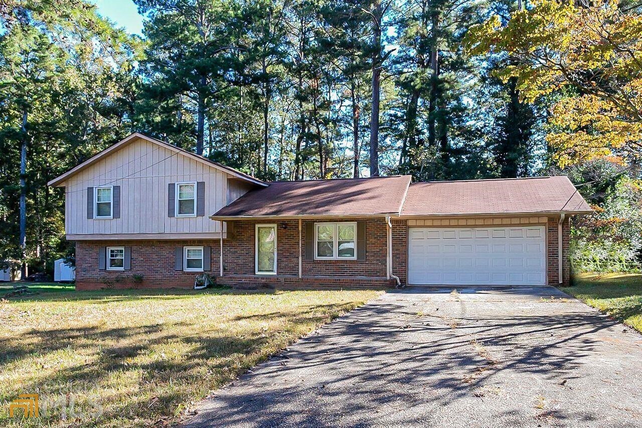 Great opportunity to purchase a solid 3 bedroom 2 1/2 bath split level home. This home is ready to renovate and call your own or it would also make a fantastic rental property to add to your portfolio. This home has a great layout with a split level plan and cool family room on the lower level with a huge brick fireplace, laundry room and covered patio. All 3 bedrooms are on the upper level. The main level has the kitchen, dining room and living room. This home has ceramic tile and hardwood flooring and just needs some cosmetic updates to be fabulous!