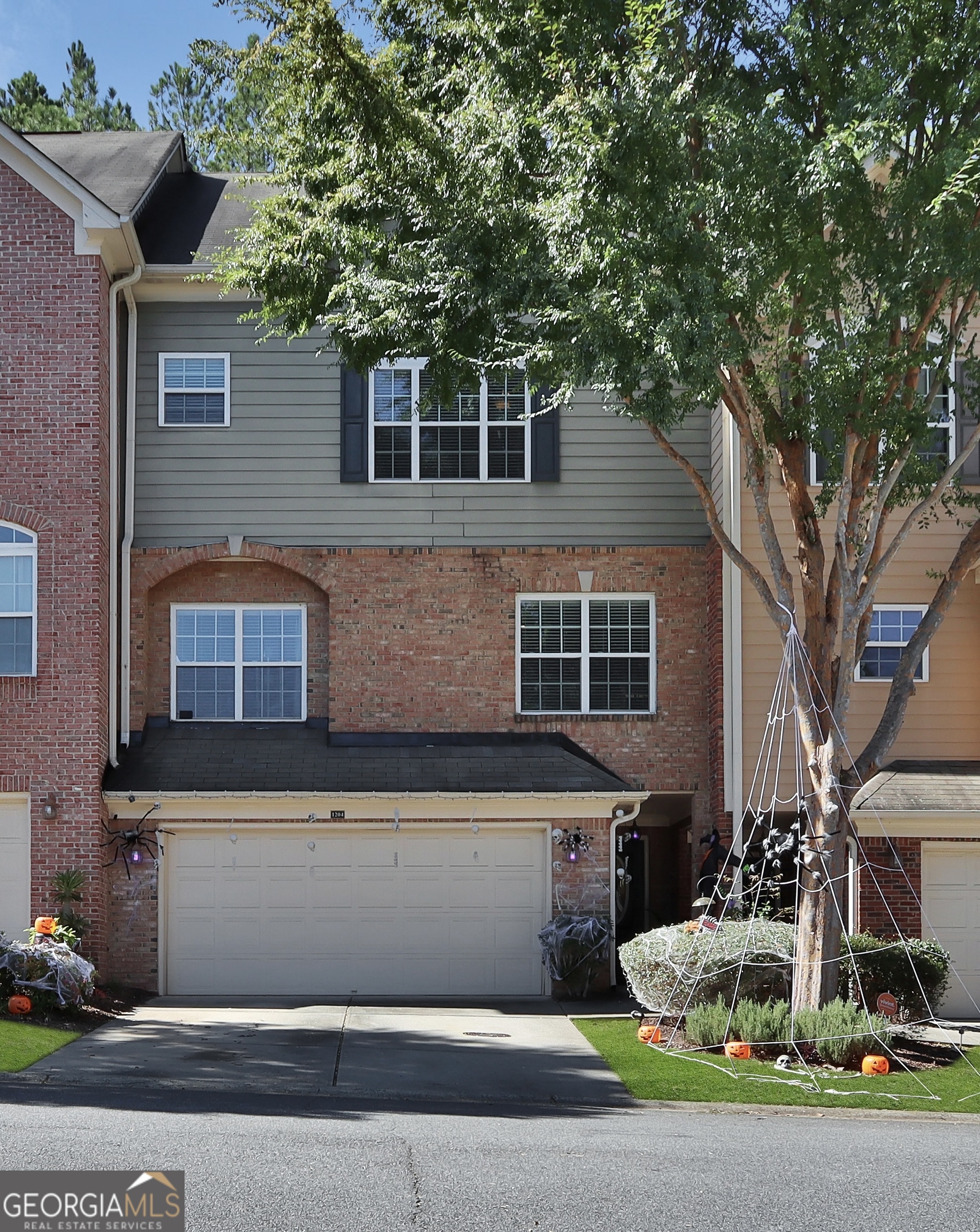 Welcome to Glen Ivy, a stunning gated townhome community just minutes from the vibrant Marietta Square! This highly sought-after neighborhood offers a sparkling community pool and an unbeatable location, with easy access to I-75 for seamless commuting. This spacious townhome is thoughtfully designed for both comfort and entertaining. The terrace-level entry features a versatile bonus room with a full bathroom, perfect for guests, a home office, or a media space. On the main level, the gourmet kitchen is a chef's dream, seamlessly connecting to the dining area and family room-ideal for hosting friends and family. The second level boasts two generously sized bedrooms and two full bathrooms, including the luxurious owner's suite. You'll love the oversized bathroom with its double vanity and large walk-in closet. The third level offers a flexible loft space, perfect for a playroom, home gym, or an additional bedroom with bathroom to accommodate guests or family members. Glen Ivy combines convenience, luxury, and charm, creating the perfect place to call home. Don't miss the chance to make this exceptional property yours!
