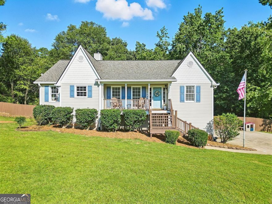 Move-in Ready. Fresh systems, stylish updates, a full private guest suite, and a big, fenced backyard-all tucked into a small neighborhood with exclusive access to amenities.  The main level welcomes you with updated luxury vinyl plank flooring, fresh paint, and a bright, open living space anchored by a stone fireplace and vaulted ceilings. The kitchen features crisp white cabinets, granite countertops, and stainless steel appliances, with easy flow to both dining and living areas. Every bedroom offers a walk-in closet, so storage never feels like an afterthought.  Downstairs is a true find: a full in-law or teen suite with its own private entrance, complete kitchen, large bedroom, full bath, and a separate living area. Whether you're hosting extended guests or need multi-generational living, this setup gives everyone space and privacy. You'll also find a workshop for hobbies or storage-and an outbuilding that stays with the home.  Step outside to a level backyard that's fully fenced and backed by trees, creating a private, open space that's ready for gatherings, pets, or a peaceful firepit night. The upper deck gives you a quiet place to sip coffee or fire up the grill. And yes, the Tesla charging station in the garage stays.  With a new HVAC in 2020, new roof just installed, and access to a pool, tennis courts, basketball, and playground shared by just 60 homes-you get community perks without the crowds.  Move in. Power up. Enjoy the peace of knowing the big stuff's already handled.