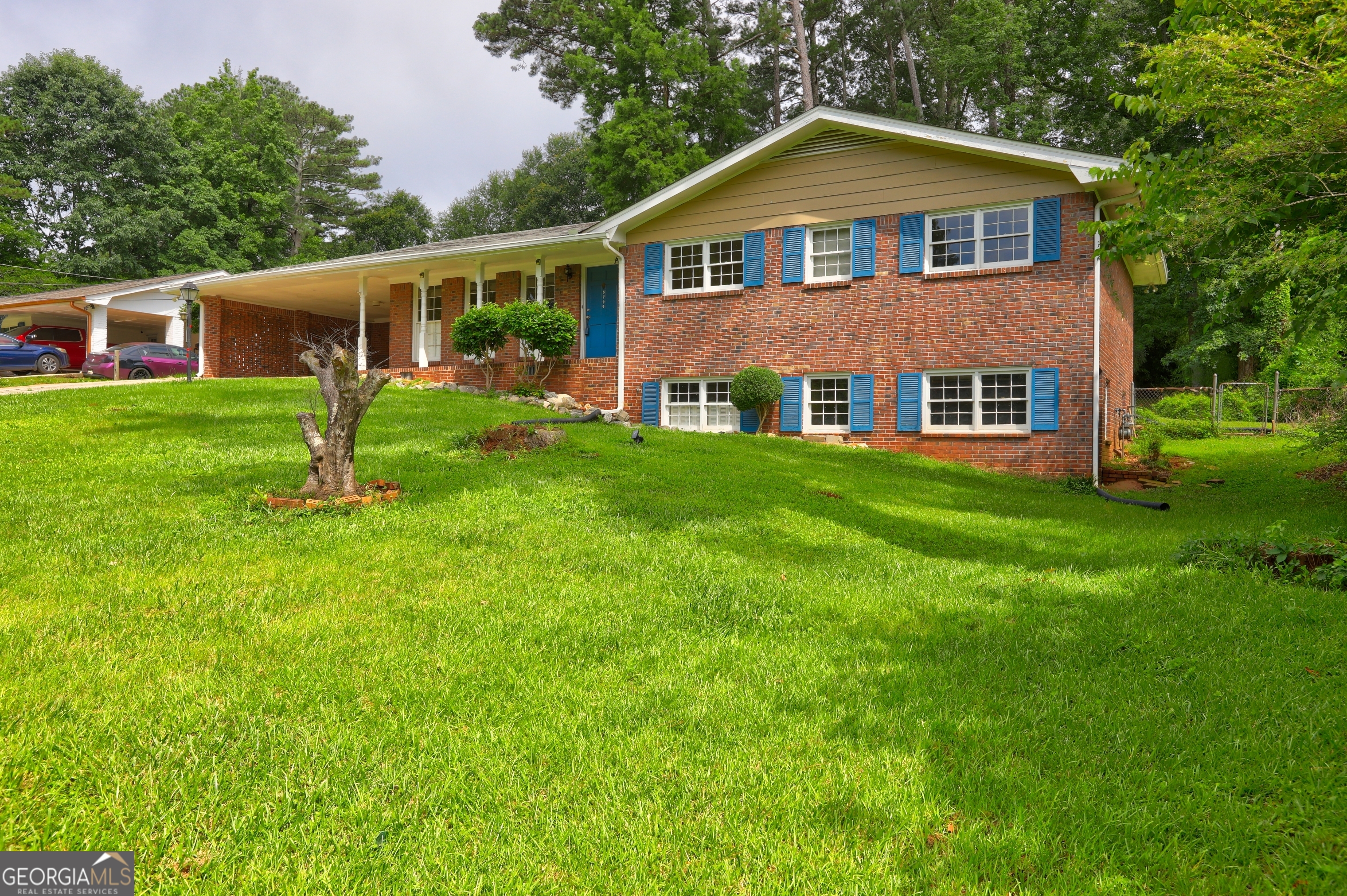 Charming 4-sided Brick Ranch with 3BR/2BA home in the heart of Norcross! NO HOA and NO Rental restrictions. Located in a well-established neighborhood, sits on 0.46 acres of land, a quiet street with a spacious front yard and a cozy balcony to enjoy your morning coffee. This home offers incredible potential with updates already underway, ready for your personal finishing touches. Inside, you'll find 2 separate Large Living rooms, a dining room for family dinners, New carpet, New Kitchen counter tops, New Range Hood, New dishwasher, and a New Water heater installed recently. The Metal chain-fenced backyard provides a private outdoor space for pets, play, or gardening with plenty of room to create your own backyard oasis. The basement is 800 sq ft, and comes with Walk-out Access. Just minutes from I-85 and a short 30-minute drive to Atlanta. Ideal for families or first-time buyers, this home offers spacious bedrooms, functional living areas, and thoughtful updates throughout. Don't miss this opportunity to own a truly turn-key property-schedule your private showing today!