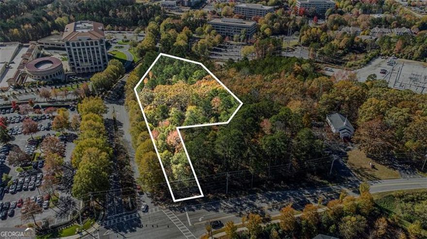 Prime Development Opportunity in Alpharetta. Discover a rare investment opportunity in the heart of Alpharetta, a vibrant community. Previously home to "The Bailey" development project, this site has over 1 million in predevelopment work completed, giving interested developers the opportunity to either pick up where the project left off or create a new vision entirely.  This prime 4.72-acre parcel, located at the coveted corner of Kimball Bridge Road and Northwinds Parkway, is just steps away from the upscale thriving live-work- play Avalon shopping and dining district.  Currently Zoned O-I ensuring flexibility for office, institutional, or mixed- use projects. This property has already received preliminary approval from the City of Alpharetta for a hotel and spa wellness center, making it an ideal choice for developers looking to capitalize on the area's high demand for hospitality, retail, luxury accommodations and wellness services. With its strategic location in a bustling area, this land offers exceptional visibility and accessibility, ensuring a steady flow of potential customers.   Don't miss this chance to invest in a rapidly growing market with endless possibilities. Whether you're looking to build a premier hotel, a wellness retreat, or a combination of both, this property is the perfect canvas for your vision. Seize this opportunity to create a landmark destination in one of Georgia's most sought-after areas.