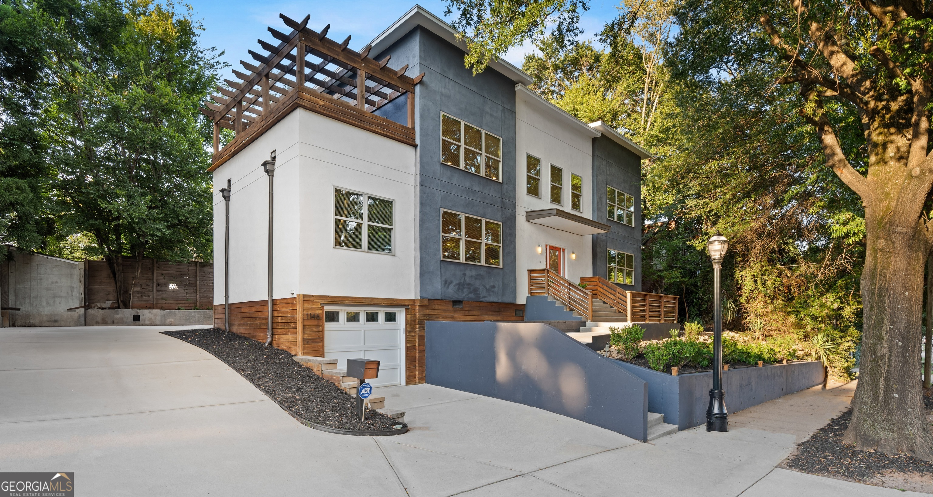 Welcome to 1146 Ponce de Leon Avenue-set along one of Atlanta's most iconic streets and surrounded by the city's premier lifestyle destinations. Just moments from Ponce City Market, the BeltLine, Inman Park, Virginia-Highland, Poncey-Highland, and Little Five Points, this modern four-bedroom, three-bathroom residence places you at the center of Atlanta's dining, culture, and entertainment scene. Inside, expansive living and dining areas create the ultimate entertainer's layout, complemented by a spacious centerpiece kitchen designed for gathering. The home's flexible floor plan includes a versatile loft upstairs that can serve as a game room, media lounge, or additional sleeping quarters. Off the loft, step outside to a private rooftop terrace with a pergola-an inviting outdoor extension perfect for dining, lounging, or entertaining. Outdoors, a private backyard invites customization, with room to create your own Zen retreat-imagine a garden sanctuary complete with a seating area, hot tub and water feature for the ultimate in relaxation and entertaining. The property also features a one-car garage plus a parking pad accommodating four additional vehicles. Whether you're seeking an in-town lifestyle, an entertainer's haven, or a unique investment opportunity, 1146 Ponce de Leon delivers unmatched access and endless possibilities.