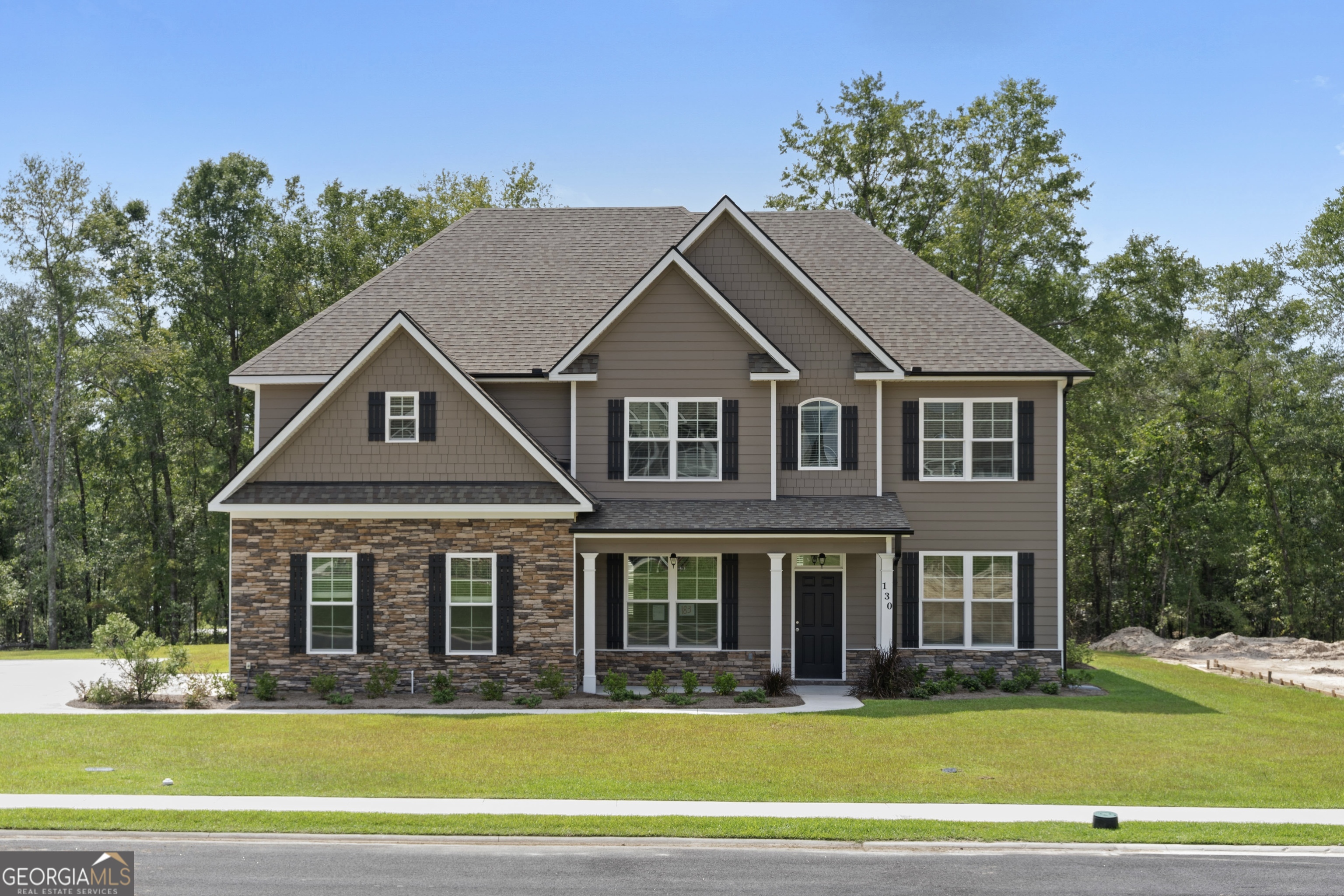 Welcome to Covered Bridge A premier luxury community where timeless craftsmanship meets modern comfort. This stunning new Faircloth Homes residence showcases one of the builder's most sought-after floor plans, designed with both elegance and functionality in mind. The main level sets the tone with a formal dining room featuring a coffered ceiling, a private study ideal for work or quiet reflection, and a spacious great room centered around a cozy fireplace. Luxury vinyl plank flooring flows seamlessly throughout, leading to a guest or in-law suite complete with a full bath. At the heart of the home, the gourmet kitchen impresses with its oversized island, granite countertops, walk-in pantry, double oven, microwave, and ceramic cooktop-perfect for both everyday meals and grand entertaining. Upstairs, an expansive bonus room offers endless possibilities as a theater, playroom, or lounge. Four additional bedrooms include a deluxe owner's suite, thoughtfully designed with a private sitting area, spa-like bath with garden tub, walk-in shower, dual vanities, and a spacious walk-in closet. Completing this exceptional home are thoughtful touches such as a side-entry garage, irrigation system, and gutters, ensuring both beauty and convenience. With its refined details and prime location in Covered Bridge, this home is an unparalleled opportunity to experience elevated living. Don't miss out!