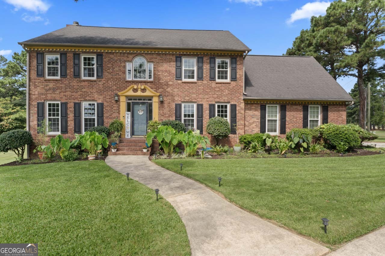 Discover timeless elegance and modern comfort in this custom-built John Wieland brick home, ideally situated on a desirable corner lot in one of Fayetteville's most sought-after neighborhoods on 1.25 beautifully maintained and landscaped acres. Thoughtfully renovated and move-in ready, this home offers the perfect balance of luxury, functionality, and elegance. Featuring 5 spacious bedrooms | 3.5 bathrooms, finished basement with private suite & amp; second kitchen, beautiful backyard oasis with pool, minutes to Trilith Studios & Piedmont Hospital **MAIN LEVEL** Step inside to a bright, open floor plan designed for entertaining and everyday living. The fully remodeled chef's kitchen boasts granite countertops, a large island, stainless steel appliances, gas stove, pantry, and a sunny eat-in dining area. Enjoy hosting in the elegant formal dining room, relaxing in the sunroom or living room, or gathering in the media room. Two convenient staircases-one off the foyer and another from the garage-make this home as functional as it is stylish. Half bath is on this level. **UPPER LEVEL** Retreat upstairs to find four inviting and generously oversized bedrooms, a full bath, and a convenient laundry room. The show-stopping master suite impresses with coffered ceilings, massive dual walk-in closets, and a luxurious spa-style bathroom featuring a garden tub, dual vanities, stand-alone shower, and skylight. Elegance at its best. **LOWER LEVEL** The finished basement expands your living options with a bedroom, full bath, living room, second kitchen, and laundry. With its own exterior and interior entry, this level is ideal for multi-generational living, a private guest suite, or even an income-producing opportunity. **OUTDOOR LIVING** Step outside into your private backyard oasis! The sparkling pool, surrounded by a fenced yard, offers the ultimate setting for summer fun, entertaining, or quiet relaxation. Additional features include a security system that is in place for peace of mind and a prime location just minutes from dining, shopping, Trilith Studios, and Piedmont Fayette Hospital. *Don't miss this opportunity*