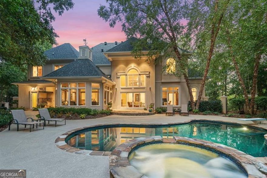 Located in the desirable neighborhood of Sandy Springs (ITP), this exceptional property has one of the largest lots in the exclusive development of Tiller Walk.  Custom designed and built by architect Killy Kunomoto, this European inspired home has many extraordinary features.  As you enter through the custom designed leaded glass doors and transom created by George Goodyear into the dramatic grand foyer with soaring ceilings, twin coat closets, beautiful trim and chandelier. Formal living room to your left and spacious dining room with hidden storage, tray ceiling and intimate cove lighting to your right. Straight through the foyer is the two-story great room with a custom fireplace flanked by built-in cabinetry and a spectacular view of the beautiful, heated pool and spa.  Brand new kitchen includes new soft close cabinetry, backsplash tile, stone countertops and new stainless steel appliances. Viking 6-burner cooktop, Thermador double wall ovens, Jenn-Air Frig. Butler's pantry & large walk-in pantry. Spacious breakfast room has entertainment bar with custom cabinetry and two beverage chillers. Overlooks tongue & grooved screened porch.  Full Pool bath and separate laundry room for added convenience on this level.  Private office/library has fireplace and overlooks the stone patio, spa and free-form pool. Take one of the two staircases up to the bedroom level where you will find the primary suite with updated bath and another custom designed leaded glass window over the soaking tub, double split vanities, two custom built out closets, tray ceiling with special lighting. Split from the rest, you will find three oversized ensuite bedrooms with updated baths and built out walk-in closets. Take the open stairway down to the terrace level for the family room and third fireplace, second bar area, game room, exercise room and 700+ bottle wine cellar. Lots of unfinished storage space Wrought Iron fencing around pool - but lot is much larger than the fenced area.  This is a must-see!