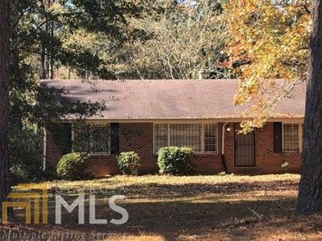 GREAT BRICK HOME nestled on nearly 2 acres of land here in Atlanta! Currently has a tenant that would like to stay but rents haven't kept with the area!. Enough room to build a 2nd home. Convenient to downtown. Westlake High, school district, this is a great area with awesome schools.