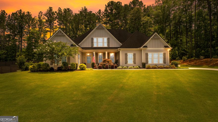 Welcome Home to Woodchase! Located just minutes from downtown Senoia, this exquisite ranch-style home is nestled in a quiet cul-de-sac and filled with high-end finishes and thoughtful design. A charming rocking chair front porch welcomes you into the home, where you will find beautiful hardwood floors throughout the main level and a spacious family room with a vaulted ceiling, custom accent wall, and cozy fireplace. The open-concept layout flows seamlessly into the gourmet kitchen, which boasts a large island, premium appliances, and a warm keeping room featuring a second fireplace and stunning wood-accented ceiling. This thoughtfully designed split bedroom plan offers privacy and functionality, with the primary suite and two additional bedrooms located on the main level, and a fourth bedroom and full bath upstairs-perfect as a guest suite, bonus room, or home office. The luxurious primary bathroom features double vanities, marble countertops, a separate tiled shower, and a relaxing soaking tub-creating the perfect retreat at the end of the day.  Enjoy meals and gatherings in the separate formal dining room, ideal for hosting special occasions or casual get-togethers. Step outside to a true backyard oasis. The expansive covered porch overlooks the professionally landscaped yard-an ideal space to relax and unwind.  Additional features include plantation shutters throughout the home, offering both elegance and privacy, as well as thoughtful architectural details throughout. This home truly has it all. Do not miss your chance to own this beautiful retreat in one of Senoia's most desirable neighborhoods!