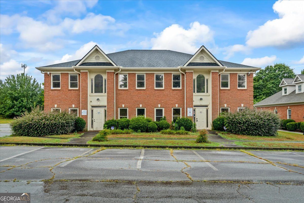 Amazing potential this property has to offer, whether you're looking to invest or need additional space for your business, this is it! 4 suites open up the multi tenant opportunity, each suite is set up with his own utility panel. All brick building means low maintenance. The property's location in Conyers, GA is an added advantage, set within a vibrant, well connected commercial precinct. The area boast an array of businesses, easily accessible amenities, and excellent transportation links, which further enhances the attractiveness of this investment opportunity. In conclusion, 883 Commerce Drive Southwest tempts with its generous upgrades, vibrant location, and strong tenant potential. This office is conveniently located close to I-20.