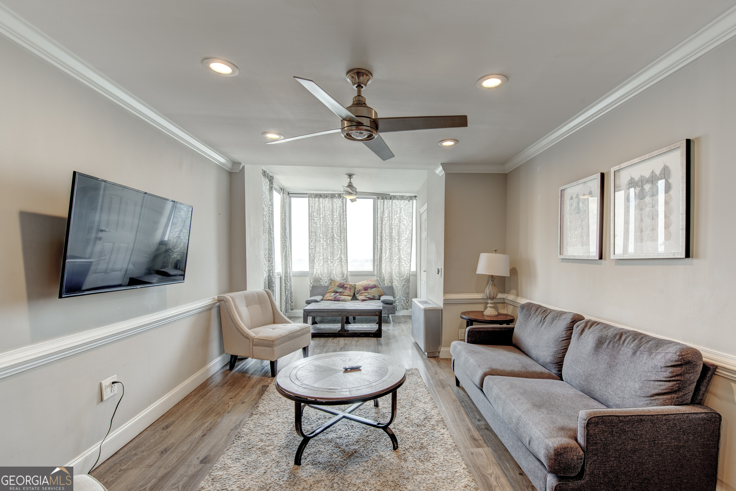 Experience FABULOUS city views in this beautifully FURNISHED 2-bedroom, 1-bathroom condo, perched on the second-highest floor of a high-rise building in the heart of Downtown Atlanta. This bright and airy unit features ABUNDANT NATURAL LIGHT, expansive SKYLINE views, and a thoughtfully designed open layout perfect for entertaining or relaxing. The kitchen is equipped with STAINLESS STEEL appliances, while the SPACIOUS bedrooms offer comfort and flexibility for residents or guests. The renovated bathroom adds a modern touch, and the unit is MOVE-IN ready for a variety of uses. This turn-key property is being sold FULLY FURNISHED, making it ideal for immediate occupancy or as a plug-and-play rental. Located in a building with NO RENTAL RESTRICTIONS, this condo presents a rare opportunity for SHORT-TERM rental income, LONG-TERM tenants, or personal use as a stylish urban home. The monthly HOA dues include utilities and INTERNET, providing convenience and added value. Step outside your door and walk to Georgia State University, Mercedes-Benz Stadium, State Farm Arena, Centennial Olympic Park, and other iconic Atlanta attractions. With quick access to public transportation and major highways, this location offers unmatched connectivity to the best the city has to offer. Don't miss the chance to own this stunning, high-floor condo in one of Atlanta's most desirable downtown buildings!