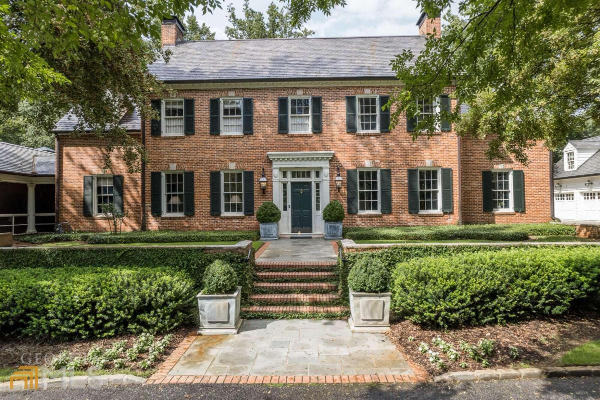 Under Contract before Published. Tradition and elegance abound in this stunning Athens Estate. This exclusive historic property has been admired by many for generations and is situated on a meticulously maintained 2.84 acre lot. Having been lovingly renovated, this home features 5 bedrooms and 4 1/2 baths in the main house. A three bay garage with a carriage house apartment with 1 bedroom, full bath and sitting room made for a beautiful addition in 2014! Upon entering the front door, you will find yourself in awe of the open staircase accented by hardwood floors with a hand painted border at the front entryway, flanked by a formal dining room to your right and a large formal living room to your left. Both of these formal living spaces feature beautiful gas log fireplaces with original mantles and 10 foot ceilings. The fine, detailed craftsmanship in the paneling, molding and trim accent each and every room, serving as a reminder that this house has been built with exquisite taste. The formal dining room features two doorways, one entering the butler's pantry, and the other allowing direct access into the gourmet kitchen. The butler's pantry and kitchen have custom inlay cabinetry and marble countertops. Serving guests is made easy with access to a dishwasher drawer, extra sink and separate ice maker in the butler's pantry. The cook of the house will be well equipped with a 6 eye gas Wolfe range, second wall oven, and SubZero refrigerator and freezer drawers. Double glass china cabinets serve as a divider between the kitchen and butler's pantry and offer a stunning place to display your fine china or bar ware. The spacious family room with a wood burning fireplace is adjacent to the kitchen, with a large bay window overlooking the lush grounds, and french doors opening onto an enormous slate courtyard. Everyday living happens in this area of the home, and the current owners have maximized the space with a built-in banquet at the bay window, flanked by built-ins on either side. In 2002, an addition was made to add an oversized, main level owner's suite, a handsome study with a gas log fireplace, and a finished terrace level with a large rec room, kitchen, and a handicap accessible bedroom and full bath. The open staircase that leads to the terrace level has a beautiful single pane palladian window offering views of the side yard, brick patio and creek. A wet bar is located in the study, making it a perfect retreat for reading or relaxing on calmer days. It's a close race between this area and the vaulted screened-in porch as to which will be someone's favorite spot in the house! A second owner's suite is located on the upper level with a beautifully renovated bath with a soaking tub, separate marble shower and heated floors. Mirrored built-ins were added to the front wall to offer additional closet space and storage. Two secondary bedrooms share a full bath with a tub/shower combo and marble countertops. One of these bedrooms has charming built-in, encased twin beds. The outdoor features of this home rival the interior with multiple brick patios, stone walkways, solid wrought iron fencing and creek views. All of these features serve as a stunning backdrop for the heated, salt water pool and spa. To tie it all together is an oversized slate courtyard with built in landscape beds and multiple access points including the owner's suite and family room. Perfection!
