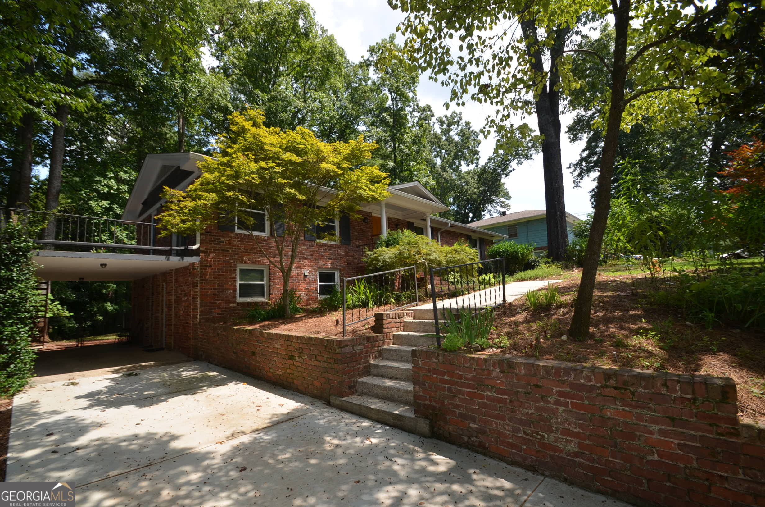Tucker, two homes in one! 3 bedrooms, 1.5 baths on main level, plus a one bedroom, one bath, in-law suite in basement. Don't be fooled from the exterior...this is a lot of house!! Both levels completely renovated with timeless features such as marble kitchens, recessed lighting, hardwood floors, open concept layouts, new windows and new electrical. (All permitted!) The main level kitchen features stainless JennAir appliances, painted custom cabinets, an island for sitting and/or prep, stainless vent hood, built-in microwave, gas cook-top, and wall oven. The main level has been completely opened up between the kitchen, dining and living rooms. There is a dedicated laundry on the main level, built-ins in the living room, and a great elevated patio with access from the living room and the kitchen. The patio is a great space to grill and create an inviting seating area. Both the full and half bath have also been completely renovated with timeless tile options. The basement is accessible from the main level plus private, no-step entry from the carport and backyard. Downstairs you will find a bright in-law suite complete with one-bedroom, living room, dining area, full bathroom, dedicated laundry, beautiful full kitchen with stainless appliances, marble counters, stainless vent hood, built in microwave, huge walk-in pantry, and bar/peninsula for more seating. Double glass doors lead you out to a private, brick patio area. Window treatments are staying with the home. A nice size workshop is accessed just off of the carport. Great care was taken in renovating this home. The driveway (includes a side parking pad) was replaced this year, the roof was replaced two years ago. Close to The Path, downtown Tucker, Stone Mountain Park, downtown Decatur, Hwy 78, and I-285. All you have to do is unpack! This is 1393 Sagewood Circle! (Photos are virtually staged)