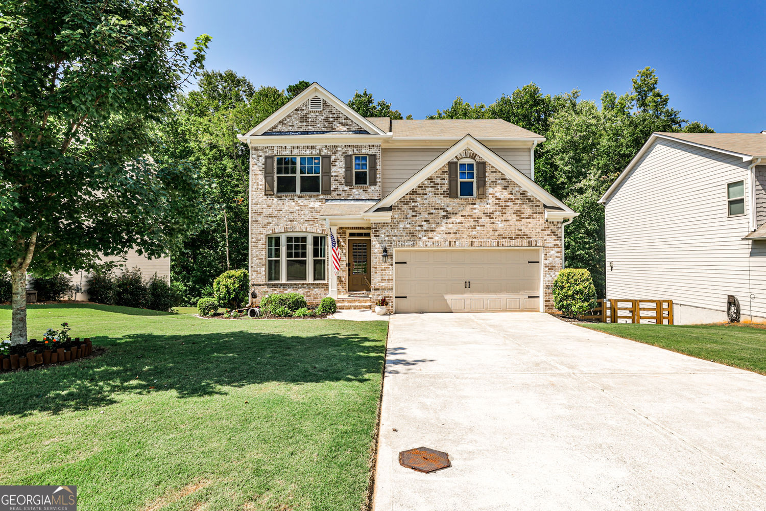 Bright, updated, and move-in ready! This home combines designer details with flexible living spaces. The open layout is filled with natural light and flows to a private backyard with peaceful creek and hillside views. The oversized Owner's Suite features a spa bath and huge walk-in closet, with three additional bedrooms upstairs offering plenty of space. The kitchen is the heart of the home with granite countertops, stainless appliances, and a sunny breakfast area. It opens to a great room with a wall of windows and a cozy gas fireplace, plus a separate dining room. The finished daylight basement is a standout - designed as a private In-Law Suite. It includes its own exterior entrance, a comfortable living area, kitchen, full bathroom, second laundry, and a flexible room that can serve as an office, guest room, or hobby space. Hardwoods on the main level, a welcoming front porch, and a private rear deck add everyday charm. The community offers swim, sidewalks, street lights, and a playground. Recent updates include lighting, fixtures, hardware, ceiling fans, screen door, and fresh landscaping.