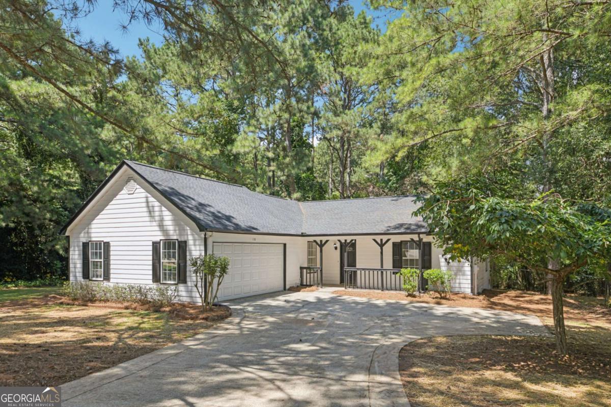 Fully renovated 3BR/2BA ranch with a modern open floor plan in McDonough! Step inside to soaring vaulted ceilings, abundant natural light, and brand-new luxury vinyl plank flooring throughout. The open-concept living area flows seamlessly into the dining space and updated kitchen perfect for both everyday living and entertaining. The kitchen showcases white shaker cabinetry, granite countertops, subway tile backsplash, and stainless steel appliances. The private owner's suite offers double closets and a beautifully updated en-suite bath with custom tile shower and upgraded vanity. Two additional bedrooms and a renovated hall bath provide flexibility for guests, family, or a home office. Enjoy outdoor living with a level backyard, fresh landscaping, and new deck ideal for gatherings, gardening, or grilling. A two-car garage and flat driveway complete the picture. Renovation Highlights (2025): New flooring throughout Kitchen with granite counters, stainless steel appliances, tile backsplash Renovated bathrooms with new tile, vanities, and fixtures Fresh paint inside & out Roof Located in the Woodcrest community, just minutes to downtown McDonough, I-75, schools, shopping, and dining.