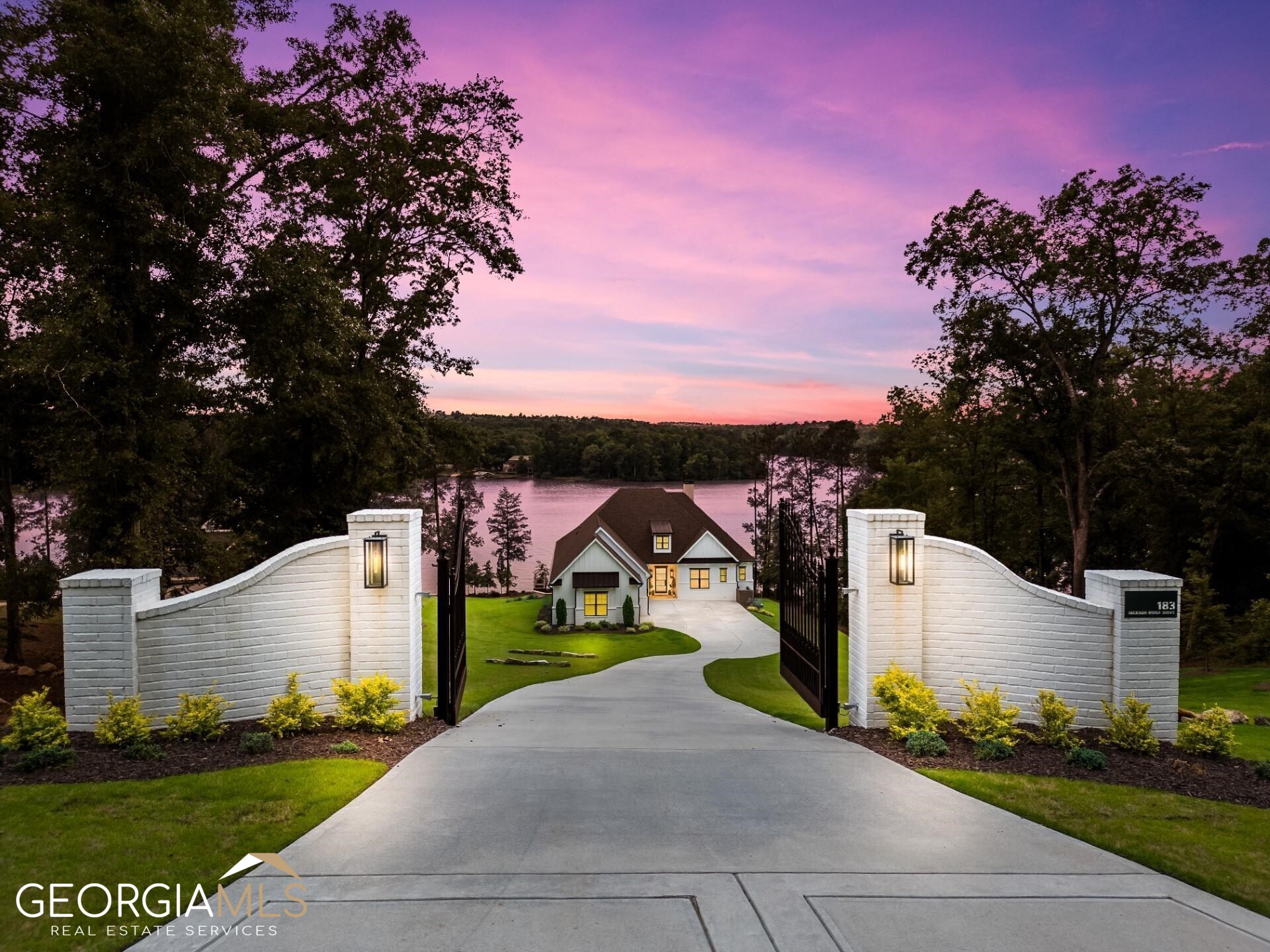 "EXPERIENCE LUXURIOUS LAKE LIVING IN THIS EXQUISITE LAKE FRONT CUSTOM HOME ON JACKSON LAKE" This custom home is located in The Reserve section of The Peninsula, an exclusive gated community in the heart of Jackson Lake. Nestled on the open waters, this deeded 1.09-acre property has 140ft of big water views. As you step inside, you will be greeted by an open floorplan perfect for hosting guests. The main level includes, 4 bedrooms/3.5 baths, a 3-car garage with 2 - 60-amp EV chargers, ceiling high cabinets in the kitchen, wood plank ceiling, quartz countertops throughout, gas stove and large pantry. From the expansive oversized porch, you can enjoy unobstructed lake views and relax while listening to music on the built in audio or watching TV in your outdoor living room. Perfect for entertaining, the terrace level has a second owners suite, ideal for guests to relax in their own space, a recreation room, media room, a second full kitchen with exotic granite tops, fitness room, safe room and more. You will fall in love with the 16x32 lagoon shaped saltwater pool, the oversized tanning ledge allows you to relax and enjoy breathtaking sunsets. A curved walk guides you through the zeon zoysia to a full size, covered boat house, an open slip with a 220-boat lift and a covered seating area that can be opened later for a second slip, 2 power jet ski lifts and a sun platform. Can't forget, 10-12' ceilings throughout, smart home technology, irrigation system fed by the lake, recirculating system on the water heaters, spray foam insulation in the attic, prewired for generator and more. The community offers gated entrance, pool, boat slips and boat trailer parking. Call to schedule your private tour to see for yourself all this magnificent home has to offer.