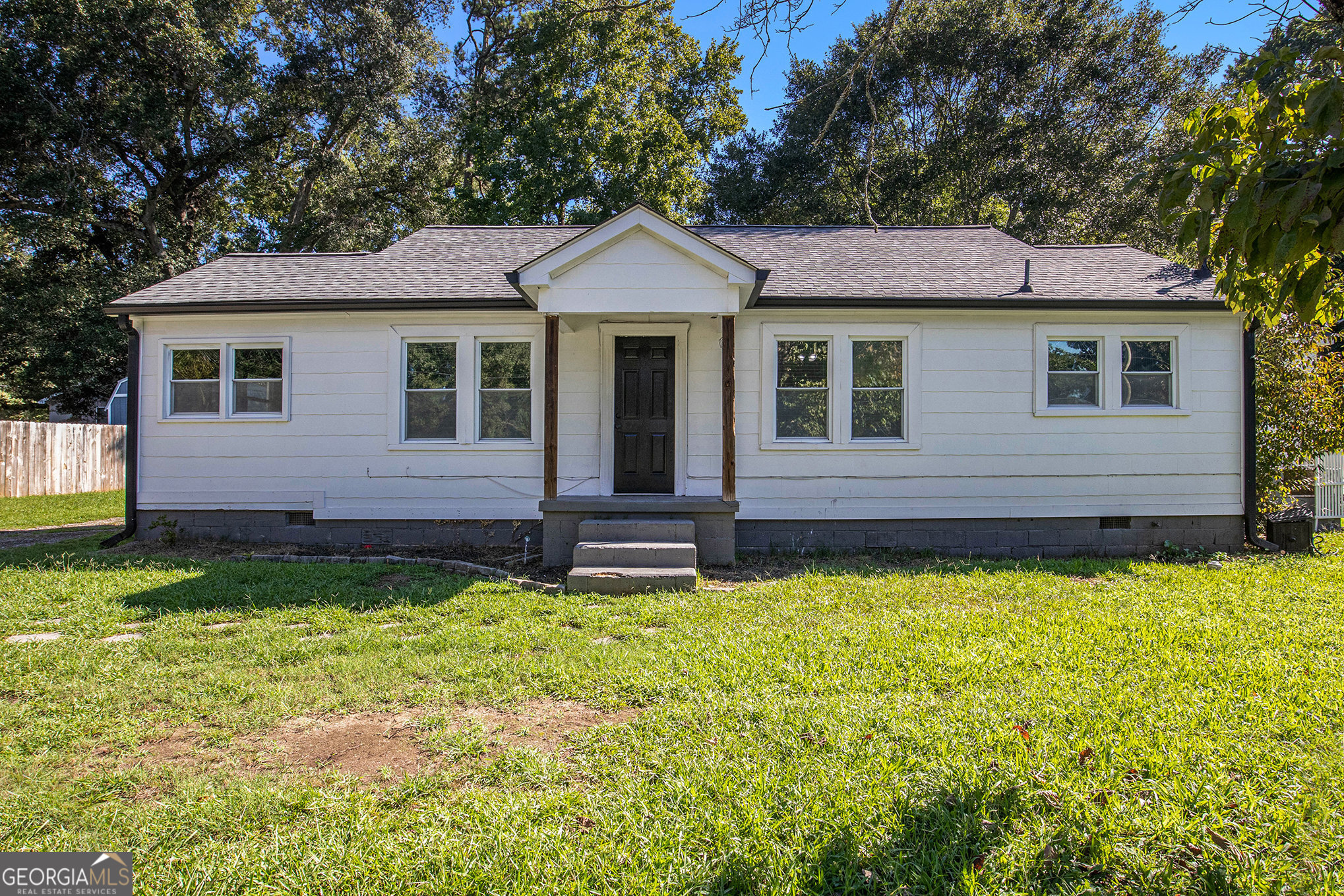 Welcome to this charming 2-bedroom, 1.5-bath bungalow in the heart of Winder! From the moment you step onto the covered front porch, you'll feel right at home. Inside, the warm and inviting family room features a fireplace, creating the perfect spot to gather and unwind. The renovated kitchen opens seamlessly to the living space and boasts a breakfast bar, stainless steel appliances, and subway tile backsplash, blending modern updates with cozy character. A flexible room off the family area can easily serve as a dining room, home office, or reading nook, while the primary bedroom with half bath provides a comfortable retreat. The bonus room offers the possibility of a third bedroom or a great hobby space. Thoughtful updates, including new flooring, give the home a fresh feel while maintaining its inviting charm. Outside, the large shed adds excellent storage or workshop potential, and the backyard offers space to relax or entertain. With its proximity to downtown Winder's shops, dining, and parks, this home is perfect as a primary residence or could serve as a great rental investment opportunity thanks to its desirable location and versatile floor plan.