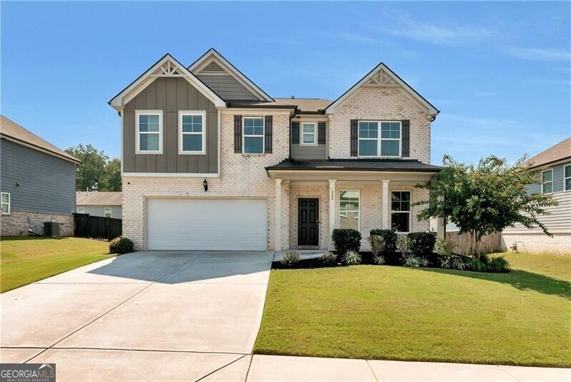 Better than new construction! This beauty has shed it's builder grade blah and gleams with ALL-NEW flooring and paint throughout! Freshly plush carpeting up with sleek, easy to clean LUXURY vinyl tile on main, plus gorgeously new stair-treads! As you step into the spacious foyer you are immediately greeted by UPSCALE lighting for a dining room or formal living room. Everyone ends up in the kitchen, right?! And, this one does not disappoint; there's tons of storage, tons of counterspace and you'll never miss the game while you're prepping a feast or sipping a cool beverage around the island with friends. PLUS a pantry big enough for all your treats and then some! Upstairs you'll find 4 large bedrooms, all with vaulted ceilings. Bunks, anyone? Each bedroom has a sizeable closet and 2 share a Jack n Jill bath. Saving the best for last- the Owner's Suite is SWEET! Unwind in the soaking tub, twirl your way to any size bed and when you're getting dressed, it'll feel like shopping in splendor; your own boutique where organization meets elegance - because your wardrobe deserves to be indulged, too! A truly quiet neighborhood makes lounging in the fully fenced backyard a true escape from the rest of the noise. Call your favorite Realtor and book a tour- you'll be grilling out and loving your new place in no time! This home is a level up and yet still convenient to shopping, parks, major highways and ATL airport.
