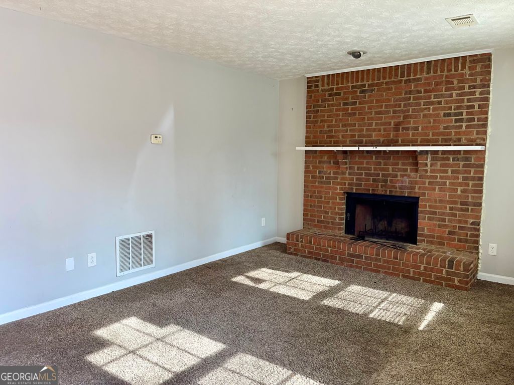 Photo of 945 Silverwood Drive, Atlanta, GA 30349 (MLS # 10792373)