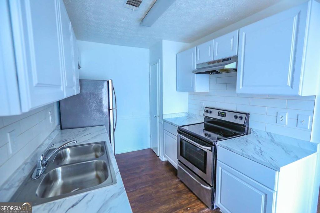 Photo of 1967 Singer Way, Lithonia, GA 30058 (MLS # 10665073)