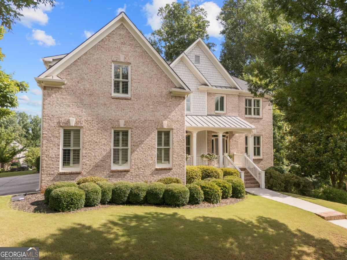 ABSOLUTELY PRISTINE AND MOVE-IN READY! This beautifully upgraded 5-bedroom, 4-bath home is located in the highly sought-after Westbrook swim/tennis community, known for its tree-lined streets and welcoming charm! Freshly painted inside this home features NEW HVAC systems, a NEW HOT WATER HEATER, and a NEWER ROOF-all major systems updated for peace of mind! The main level offers a cozy family room with soaring ceiling and fireplace, a dedicated office, formal dining room, and guest suite with a full bath. The heart of the home is the fully RENOVATED Kitchen, boasting an expansive island, Quartz counters, designer backsplash, vent hood and a custom-designed walk-in pantry-all complemented by updated lighting throughout. Just off the kitchen, enjoy your covered and screened-in porch, ideal for relaxing or entertaining year-round. Upstairs, The spa-like primary bath offers dual vanities, an oversized shower, and two private water closets-providing both luxury and functionality. You'll also love the separate his-and-hers walk-in closets, offering ample space and organization. You'll also find three spacious secondary bedrooms, two full bathrooms, a bonus/flex room, and a designer laundry room with high-end finishes. The large unfinished terrace level is ready for your personalization-perfect for future expansion. The exterior has been freshly landscaped and offers incredible curb appeal. Enjoy a 3-car side-entry garage and the privacy of a quiet cul-de-sac with green space, offering a peaceful setting and a great spot for casual gatherings with friends and neighbors. Westbrook offers resort-style amenities including a Jr. Olympic pool, lighted tennis courts, playground, clubhouse, and active social calendar. Conveniently located near the Big Creek Greenway, Cumming City Center, GA-400, shopping, dining, and top-rated Forsyth County schools, this home offers the perfect blend of luxury, comfort, and community. Don't miss your chance to call this exceptional property home-schedule your showing today!