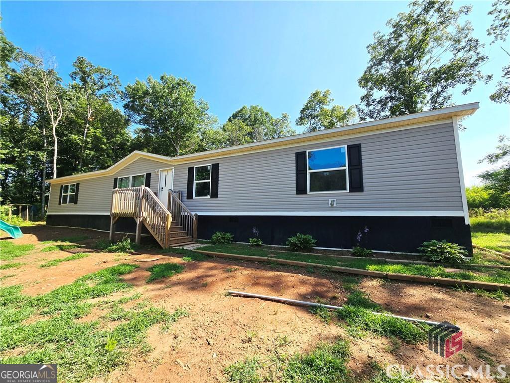 YOU are stepping into Equity when you purchase this home! This home already appraised for over $312k! Welcome to this charming 2022- built home sitting on 2.15 acres. Its near-new condition and expansive layout, featuring five bedrooms and 3 full bathrooms, provide ample space for family living and entertaining. The generously sized master suite boasts a private bathroom and walk-in closet. The split=bedroom design includes a dedicated dining room and over-sized living room. Outdoors you will find a fenced in area devoted to your pups to keep them safe. The home also offers a swing set and chicken coops. Schedule a showing today to experience this exceptional property. Please be assured that the recent price adjustment does not reflect any underlying issues with the property. The sellers are simply motivated to begin construction on their new residence.