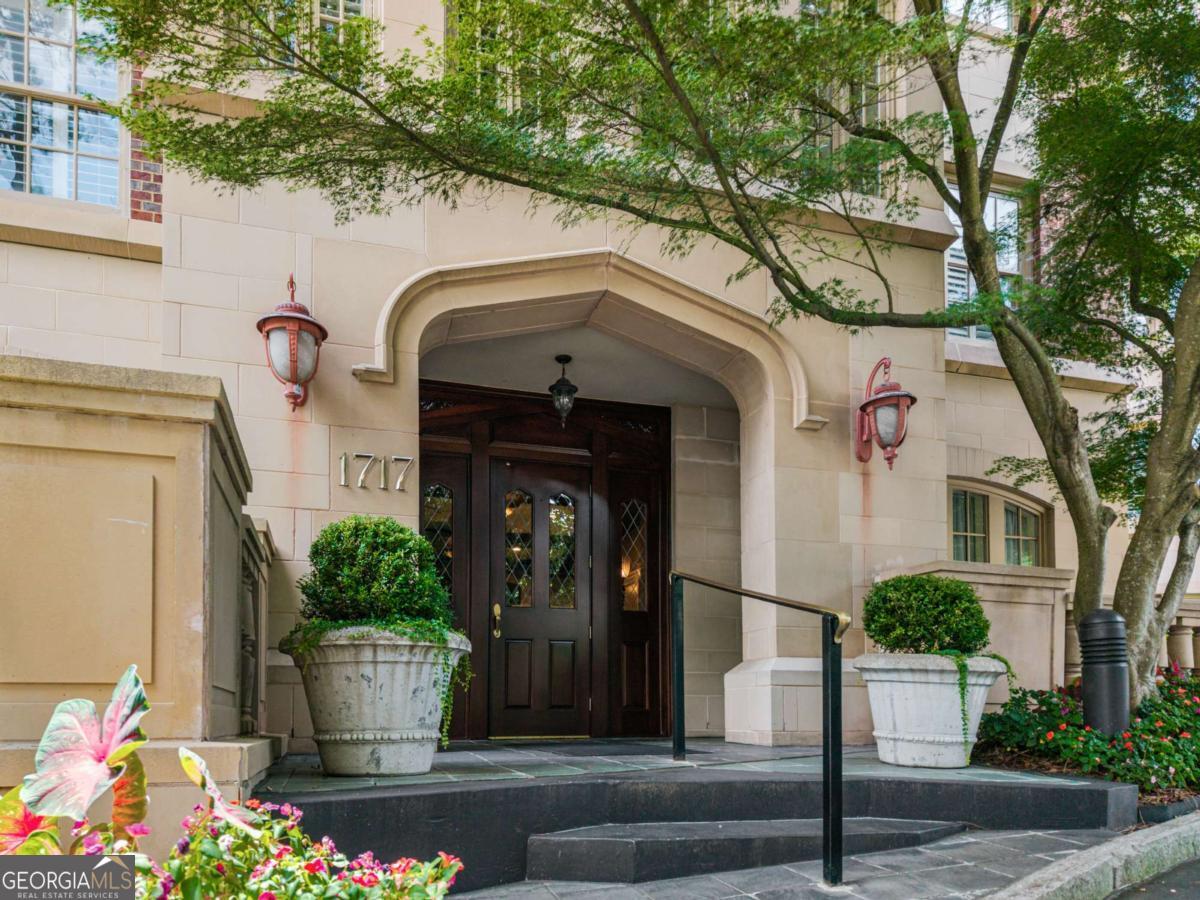 Welcome to The Clifton, one of Atlanta's most sought-after luxury residences. Ideally located just steps from Emory University and the CDC, this spacious 2-bedroom + Office, 2.5-bath condominium offers elegant living with oversized rooms, soaring 10' ceilings, and extensive molding throughout. The inviting family room features a fireplace and a charming bay window that fills the space with natural light. A separate office provides the perfect setting for work or study. The kitchen is equipped with a new microwave, cooktop, and oven, ready for the home chef. The primary suite is a true retreat, complete with its own fireplace, private access to the porch, a walk-in closet, and a spa-like bath with double vanity, separate tub, and shower. A second bedroom with an en-suite bath ensures comfort for guests. Additional highlights include three deeded parking spaces, a storage unit, and the convenience of a full-service concierge. Residents enjoy top-tier amenities (pool, club room, fitness center, and guest suite) in this prestigious community, all within minutes of Emory, the CDC, dining, shopping, and green space.