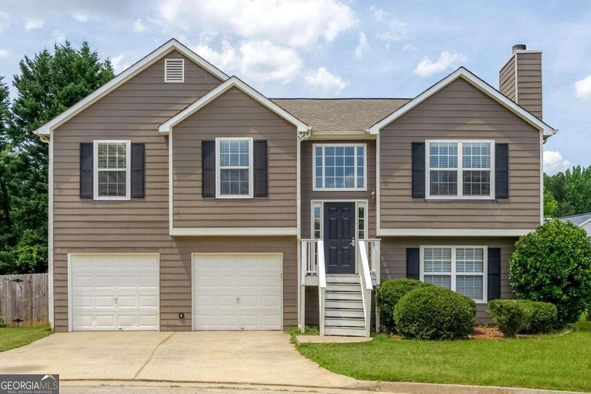 Welcome to your beautiful home located in Acworth! This 5 bed 3 bath home is one of the largest floor-plan offered in the subdivision! It has it all from hardwood floors throughout the main level, the spacious kitchen has ample counter space and stainless steel appliances, large bonus room downstairs perfect for home office or man cave! The list goes on! Neighborhood amenities include a clubhouse, swimming pool, tennis courts, and playground. Awesome location near shops, restaurants, KSU, and I-75. HOA Fee is included in the monthly rent.
