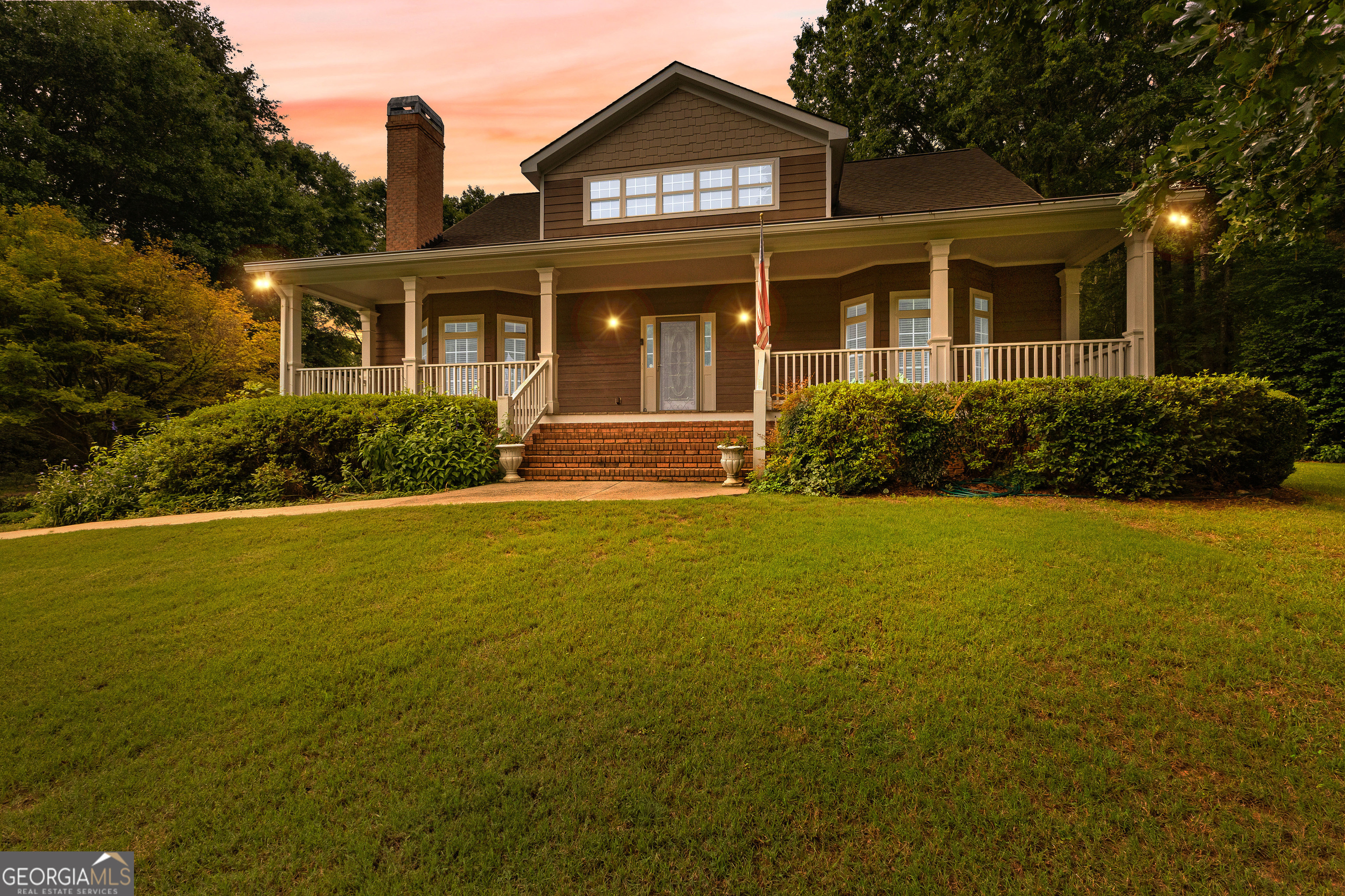 Beautifully custom-built and meticulously maintained, this one-owner home sits on nearly 2 acres in sought-after Fayette County. Designed with timeless craftsmanship, it showcases stunning millwork, oversized rooms, and a spacious three-car garage. The primary suite is conveniently located on the main level, while each additional bedroom features its own private bathroom. Upstairs, you'll also find a large bonus room along with unfinished space that could easily be completed as a fourth bedroom. The property is a dream for nature lovers, with thoughtfully designed landscaping, vibrant plantings, and a serene waterfall garden. Inside, the home offers an expansive dining room, a formal living room with fireplace, and a warm family room with custom built-ins. The gorgeous kitchen is generously sized, ideal for gatherings and entertaining. Outdoors, a large barn provides even more space and endless potential-perfect for storage, hobbies, or future customization. This exceptional property is truly one of a kind and ready for its next owner to make it their own.