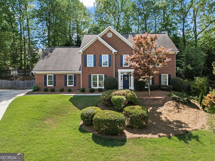 This MOVE-IN READY traditional brick home with a side entry garage in a popular East Cobb SWIM/TENNIS community is a rare find!  Nestled back on a quiet cul-de-sac with a WALKOUT backyard and a POOL your family will love this home and never want to leave.  This home is situated on an extra wide lot that provides an abundance of outdoor living space for the entire family.  The backyard is an absolute OUTDOOR OASIS with a recently updated Pebble Tec pool with waterfall, a large area for grilling, expanded seating/lounging areas and a lawn area for kids to play. Inside, the recently updated kitchen is a chef's dream with newer cabinetry, a large island with seating, gas cooking and a vaulted eat-in breakfast area overlooking the backyard.  The adjacent family room with gas fireplace and wet bar offers a wonderful place to relax with family and friends.  Also on the main level is a large dining room, a HOME OFFICE and a laundry room. On the upper level you'll find the primary suite with double vanity, soaking tub, and separate shower, along with three additional bedrooms and a second full bathroom.  The upstairs BONUS ROOM serves as a perfect kids den or playroom and has direct access to the downstairs via back stairwell.  This home has been extremely well-maintained and has numerous upgrades including: new Carrier furnace, all PEX piping, new windows, Nest thermostats, WIFI enabled garage door opener, electric vehicle charger, new light fixtures and more!  All of this on a professionally landscaped lot in the sought out Walton high school district.