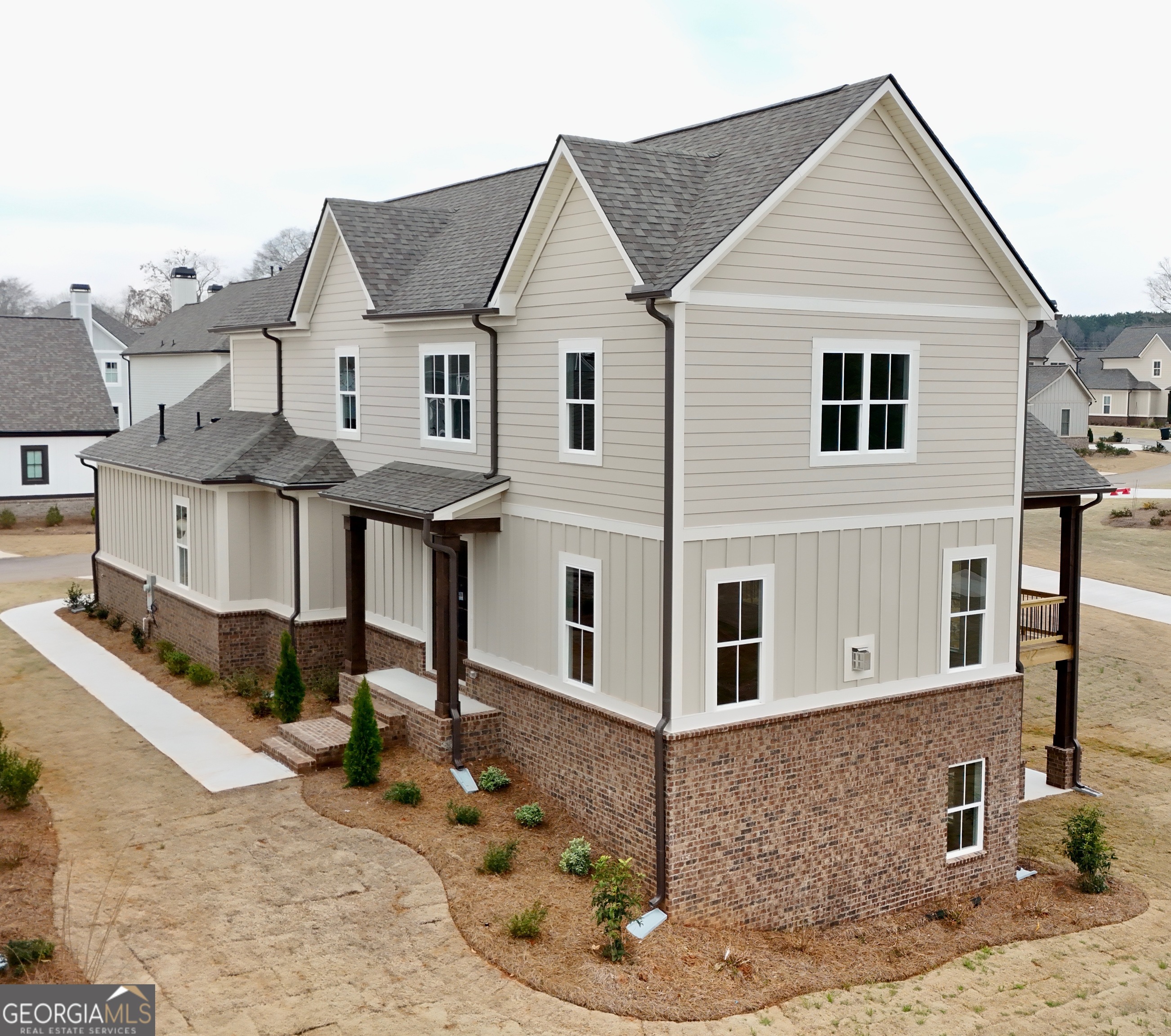 Welcome to Luxury Cottage living in Watkinsville's premiere community, Trove. Cottage 5 features the primary bedroom on the main floor with 4 bedrooms and 3.5 baths. On the main level, the family room is open to the gourmet kitchen and dining area. The gourmet kitchen features granite countertops, tile backsplash, an island, a pantry, gourmet stainless steel appliances, and hardwood floors. Also featured are the office and the primary bedroom suite. The primary bedroom has a beautiful bathroom and a walk-in closet. Stairs with/ oak handrails and wrought iron spindles lead upstairs. 2nd floor features 3 secondary bedrooms and 2 baths. The exterior features a covered deck with a fireplace. This home also features an unfinished basement. For information and showing call Carmen Rhodes 770-630-2220