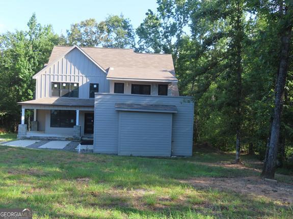Take advantage of this craftsman style home that construction needs to be completed in the beautiful Spread Oak Plantation community. Turn this into your Dream Home! 5 Bedrooms, 4 Full Baths, open floor plan. 5th bedroom could be used as a nursery or office as it connects to the Primary Bedroom and Bath by a hall. The kitchen features Cherry custom cabinets, with a granite counter tops, tile flooring and a large custom island. There is also a Tankless Water System so you can keep the hot water flowing. This home is sold AS-IS with no Seller Disclosure. The Seller has never occupied the property.