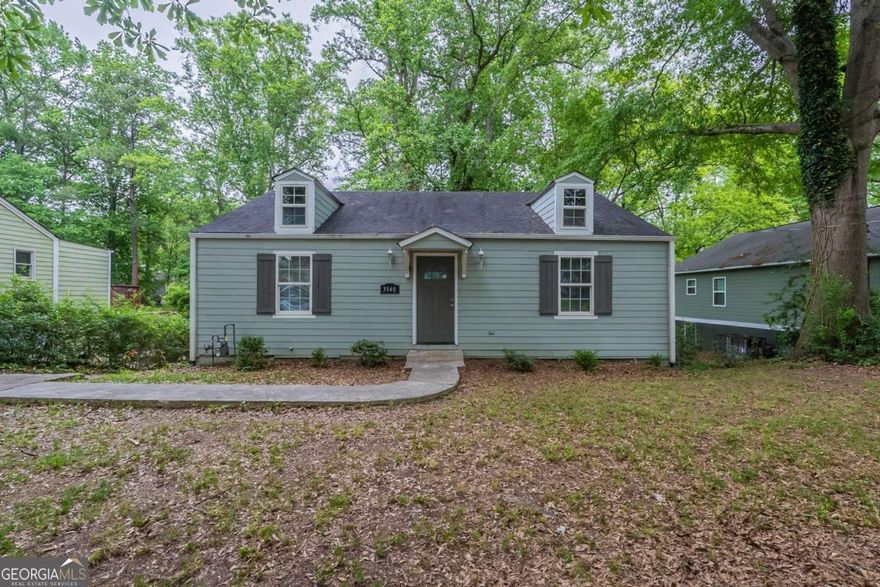 This beautifully updated 3-bedroom, 2-bath ranch home in East Point offers stylish finishes and an open floor plan perfect for modern living. The kitchen features granite countertops, stainless steel appliances, and a counter-to-ceiling subway tile backsplash. A private ensuite in the primary bedroom includes a floor-to-ceiling tiled shower and a sliding barn door for added charm.    Enjoy outdoor entertaining on the back deck overlooking a level, fenced backyard. Located less than five minutes from downtown East Point, this home combines character, location, and convenience-ideal for first-time buyers or investors looking for a turnkey opportunity in Fulton County.
