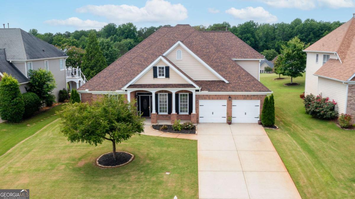 Charming ranch home with stunning golf course views! This spacious 5-bedroom, 3.5 - bathroom home features 4 bedrooms on the main level and a 5th bedroom upstairs with its own full bath. Enjoy fresh updates including new carpet and paint throughout. The open floorplan is perfect for entertaining, complemented by a huge screened patio ideal for relaxing or hosting. The custom no-step master shower adds a touch of luxury and accessibility. Don't miss this move-in-ready gem in a prime location!
