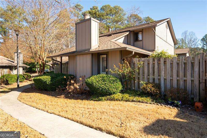 Charming 3 Bedroom, 2.5 Bath 2 story condo located in Manning Villas in Marietta. Approx 2 miles west of the Marietta Square. 2-Car garage plus additional parking spaces for guests. Plantation Shutters throughout! 2 fenced enclosed patios. Updated Kitchen with extra island with lots of storage space. Fireplace in Living room, Dining area off kitchen, 3 Bedrooms and 2 Full baths upstairs. Master Suite has a walk-in closet. Half Bath downstairs. New HVAC in 2024. This beautiful community offers a clubhouse and pool. Great location! Walking distance to Burrus Elementary School.