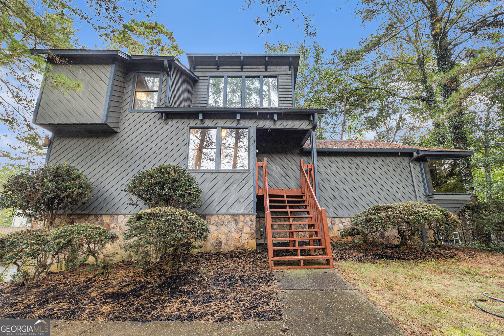 Spacious and inviting, this beautiful home offers a warm family room complete with a cozy fireplace-perfect for gatherings or quiet evenings. The separate formal dining room provides an ideal setting for entertaining, while the eat-in kitchen boasts solid surface countertops, stainless steel appliances, and ample space for casual meals. The main-level primary suite features a generous walk-in closet and a luxurious ensuite bathroom with a separate shower and a relaxing soaking tub. Upstairs, you'll find a versatile loft area, two additional bedrooms, and a full bath-perfect for family or guests. Enjoy outdoor living on the large deck, ideal for grilling or enjoying your morning coffee. Additional highlights include a two-car garage with an extra room, perfect for storage, a home gym, or hobby space.
