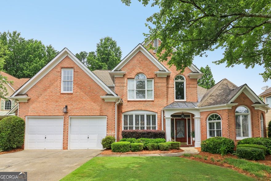 I am excited to share a beautiful home that just hit the market! Located in a highly desirable area with excellent schools and situated on a quiet cul-de-sac, this property offers both convenience and charm. This home is just a hop and skip away from Newtown Park, which includes a dog park, playground, sports complex, and walking trails. There also are free exercise classes, summer concerts,** and** summer movies on a large screen in addition to other activities. The exterior boasts a meticulously manicured lawn and a welcoming covered entry with a stained wood door and glass inset. Inside, you'll be greeted by an abundance of natural light and neutral tones, complemented by refinished light hardwood floors. To the left, you'll find a formal dining room with tray ceilings and wainscoting with a generous chair railing. Straight ahead, the two-story family room is spacious and has tall windows, a fireplace with marble surround, and custom built-ins with accent lighting**,** creating an impressive living space.    The spacious family room flows seamlessly into the updated kitchen and breakfast area. The kitchen features white cabinets extending to the ceiling, under-cabinet lighting, a central island, ample granite counter space, and stainless steel appliances. A convenient writing desk and a spacious pantry complete this inviting space. Nearby, you'll find a well-appointed powder room and a laundry room with cabinets.    The primary suite, located on the main level, offers a double-tray ceiling, accent lighting, and new carpeting. It includes a comfortable sitting room, two separate closets with custom cabinetry, and an updated bathroom with separate vanities, a seamless shower, a garden tub, and plenty of natural light. If you would rather, the sitting room can easily be converted to an office or formal living room by adding an entry door at the foyer.    Upstairs, there are three generously sized bedrooms and a versatile bonus room with ample storage. The hall bath features a double vanity, thoughtfully separated by a door from the water closet and tub/shower.    Step outside to the spacious screened porch with tile flooring, perfect for outdoor entertaining. It can comfortably accommodate a dining table for six, as well as a sofa and three chairs, and is pre-wired for a TV. Adjacent to the screened porch is a grilling patio. The expansive backyard offers two large, flat lawn areas, ideal for outdoor activities or recreational equipment.