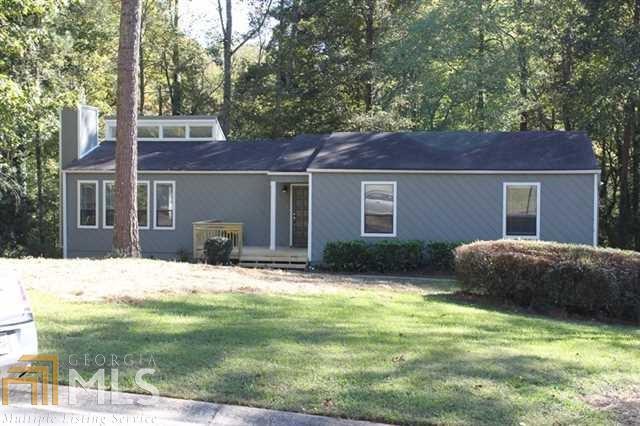 MOVE IN READY! Seller spent money and remodeled the entire house inside and out! Newer Roof, All New Gutters and Downspouts, Painted Interior and Exterior with Sherwin Williams, new carpet, new light fixtures throughout, new ceiling fans, updated bathrooms, new granite countertops in kitchen and baths, painted cabinets throughout, new floors in baths, new oversized deck & added stairs, new front porch entrance & column, gutters, new retaining wall, and so much more. Amazing Renovation with big ticket items already done. CREEK PARK AND WENDWOOD next to each other