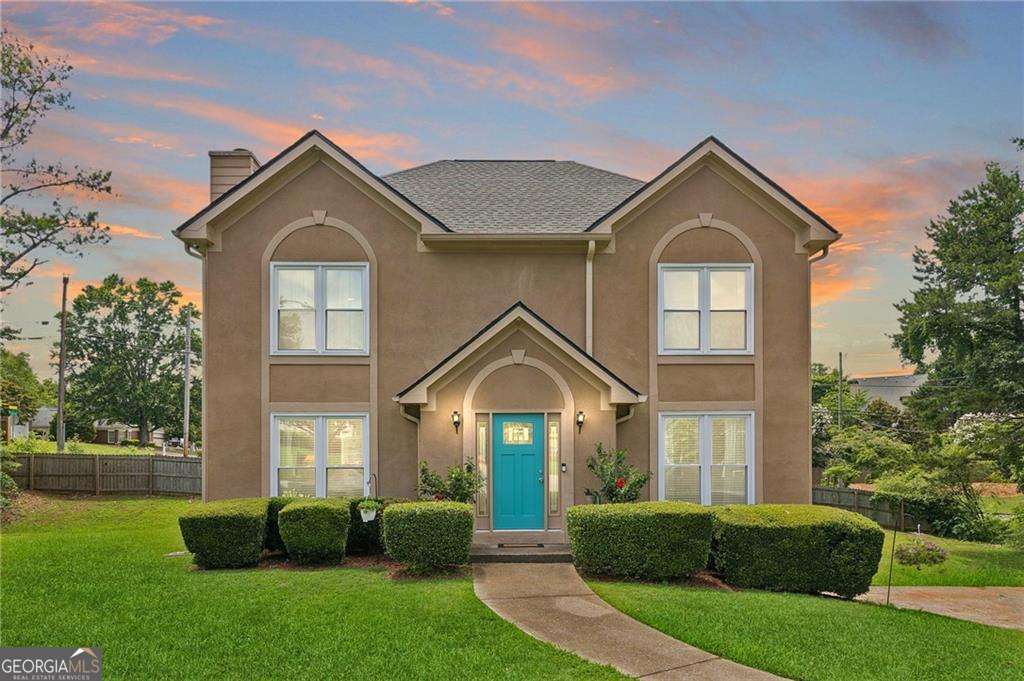 Classic style. Prime location AND an assumable loan at 2.25%. Brand new roof, windows, and updated major systems make this timeless traditional the one you've been waiting for! Nestled on a quiet cul-de-sac, this home features a classic layout with fireside family room, bright living room/den/office, and elegant formal dining room with wainscoting. At the heart of the home, the kitchen showcases wood cabinetry, granite countertops, and pantry open to a sunny breakfast room. Enjoy main level access to the spacious deck overlooking the private backyard. Upstairs, the primary suite is a private retreat with walk-in closet and spa bath with brand new dual vanities, jetted soaking tub, and separate tiled shower. Need room to grow? Unfinished terrace level has ample storage space with potential for future expansion, and an oversized two-car drive under garage. Evenings shine brighter with ambient exterior lighting that turns heads and sets the perfect tone. Why settle? An unbeatable value in Lakewood Colony, located in an amenity-rich community serving up poolside weekends, top-rated East Cobb schools, parks, shopping, and everything you need just minutes away. Discounted rate options and no lender fee future refinancing may be available for qualified buyers of this home.