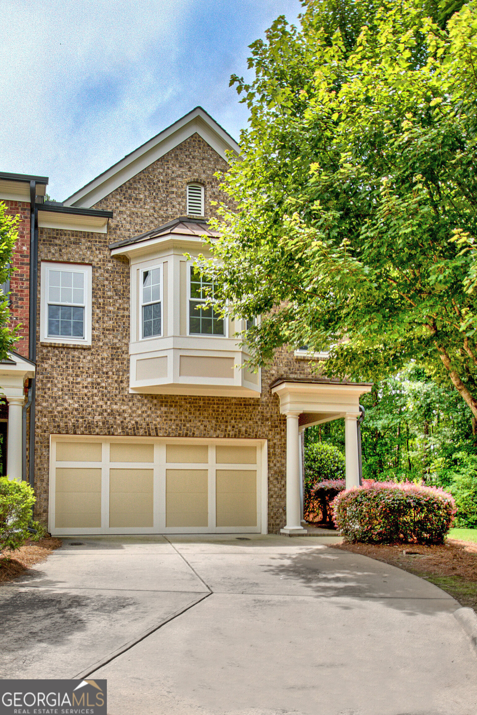Private End-Unit Townhome in Sought-After Legacy Square in Centennial. Beautifully maintained end-unit built by renowned John Weiland builder offers a rare blend of space, privacy, and elegance. Step inside the Crawford plan, featuring soaring 14-foot ceilings throughout and gorgeous 8-foot glass front door creating a light, airy feel. Enjoy the complete privacy out every window-and a fenced backyard that feels like your own private retreat! The open-concept kitchen is perfect for entertaining, featuring an enormous granite island, gas range, stainless appliances all opening to the spacious living and dining areas. Upstairs, a versatile loft space with room to work, relax or play. Enjoy 3-oversized Bedrooms and 2 full baths, including a luxurious primary suite with solid-surface flooring and an elegant double vanities, custom cabinetry, jacuzzi tub, tiled shower and generous walk-in closet. Secondary bedroom with built-in window bench perfect for a reading nook. Also includes a pocket door accessing the second full bath, making it ideal for privacy. Hardwood and luxury vinyl plank flooring run throughout the home--brand new carpet on the stairs and secondary bedrooms. Entire home has been completely repainted, new carpet, New Carrier HVAC with 10-year warranty. Spacious 2-car Garage at kitchen level with half bath on main. Covered back porch comes equipped with a perfect spot for your TV. Enjoy the view of your peaceful, private fenced backyard. Additional perks include: Original owner--lovingly cared for and move-in ready, ease of living with HOA covering exterior maintenance including roof, yard care, termite bond plus access to resort-style amenities: swimming pool, tennis courts, fitness center, playground and clubhouse. Come relax with carefree living in a highly desirable community in Peachtree City, just minutes on the golf cart to shops, dining and top-rated schools. This one checks all the boxes!
