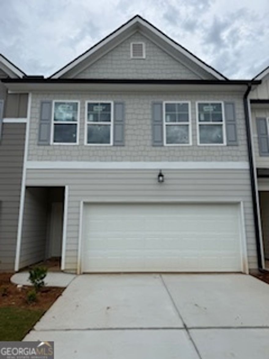 Ask me about our Incentives!!!Modern Luxury Townhome in Rivershire Place. Nestled in the sought-after Villa Rica area, Rivershire Place offers a harmonious blend of modern living and convenience. This meticulously designed townhome features an open-concept layout, high ceilings, and a smart home technology package. Modern kitchen with stainless steel appliances, 42" white cabinets, tile backsplash, granite countertops, large island, and pantry. Oversized owners' suite with walk-in closet and spa-like ensuite bathroom with oversized shower. All rooms equipped with 2" faux wood blinds. Scheduled to be completed in December. Conveniently located just minutes from I-20 and Downtown Villa Rica, offering diverse dining options. A short drive to Sweetwater Creek and Arbor Place Mall adds to the appeal of this vibrant community. Please schedule an appointment to tour our decorated model homes.  Home is completed. Exterior is exact photo. Interior photos are stock photos of the decorated model home with the same floor plan.