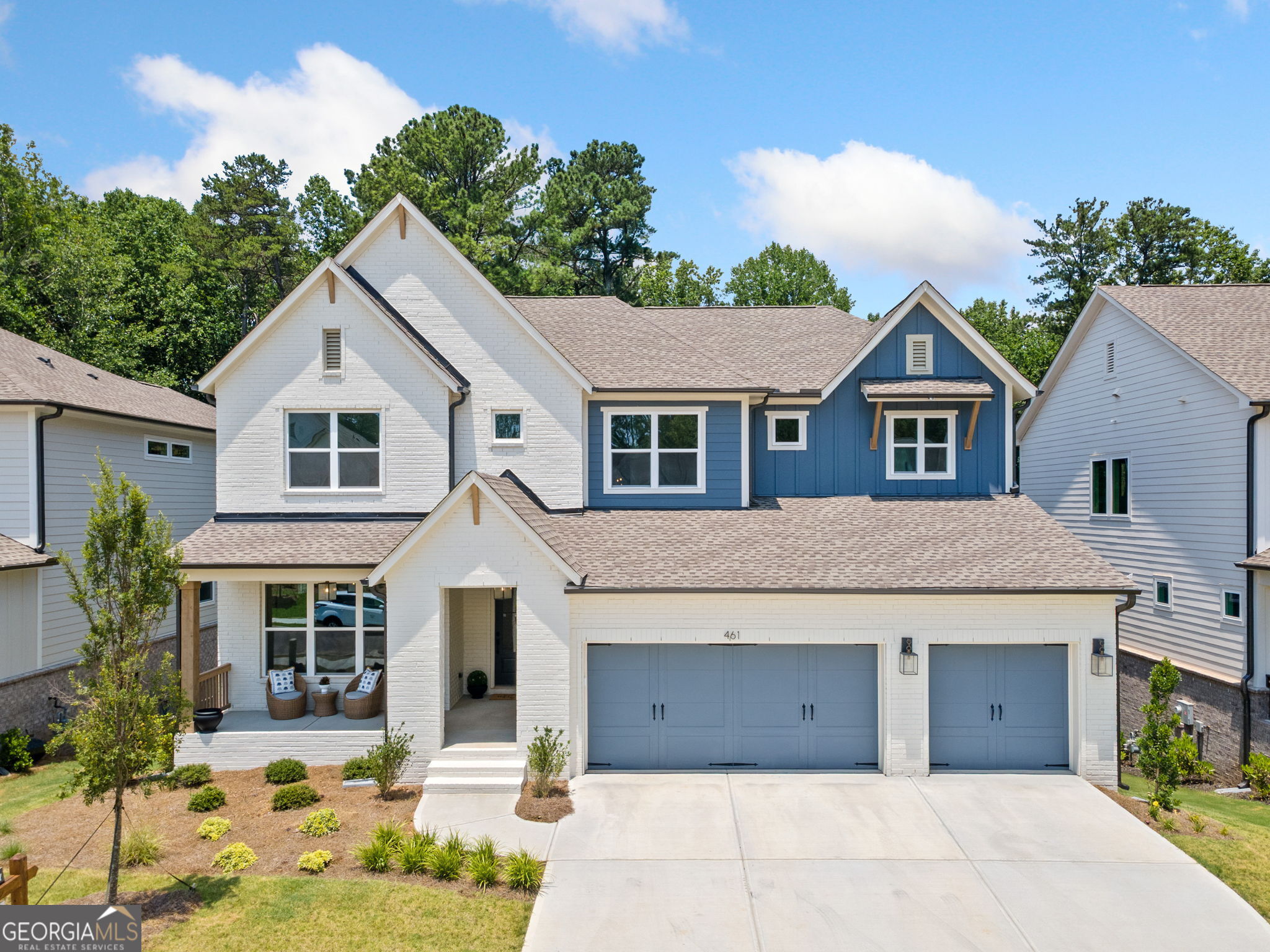 Welcome to 461 Maypop Lane-a brand new, never-lived-in home located in a vibrant, newly built community designed for comfort and luxury. This thoughtfully upgraded residence offers over 5,300 square feet of elevated living, blending functional elegance with exceptional design. Every detail has been tastefully curated with countless upgrades throughout-from the wide-plank hardwood floors to the designer lighting and 9+ foot ceilings on every level. The main floor features an open-concept layout flooded with natural light, anchored by a stunning waterfall-edge island, stainless steel Whirlpool appliances, and a spacious walk-through pantry that leads to a secondary kitchen prep area-perfect for entertaining or everyday ease. Upstairs, the primary suite serves as a serene retreat, complete with dual vanities, a frameless glass shower, and generous closet space. Additional bedrooms offer comfort and flexibility, while a bonus flex space adds versatility for a playroom, office, or media area. The fully finished terrace-level basement offers an expansive and versatile layout, featuring a private bedroom, full bathroom, and generous storage space. This open-concept space is ideal for creating a media lounge, home theater, game room, or even a private gym or in-law suite, tailored to suit your lifestyle. Plush carpeting throughout adds warmth and comfort for everyone. Experience luxury living at its finest in a community designed for connection and enjoyment, complete with nearby parks, trails, schools, and shops. This is your chance to own a move-in-ready home without the builder wait, with the benefit of premium finishes already in place.