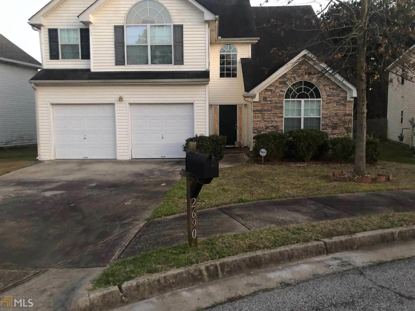 This beautiful home is uniquely situated in the cul-de-sac of a quiet and quaint neighborhood. Finished with stone and vinyl on its exterior, 2-story foyer and catwalk. 4 bedrooms on the upper level, 2 baths, and 1/2 bath on the lower level, as well as a fireplace. Family room, dining room, and eat-in kitchen and the master bedroom is complete with a sitting room, full-bath and walk-in closet. This is a lovely home and is the perfect single-family home for you and yours that is also conveniently located near the Atlanta Airport and access to all major highways. SOLD AS IS.