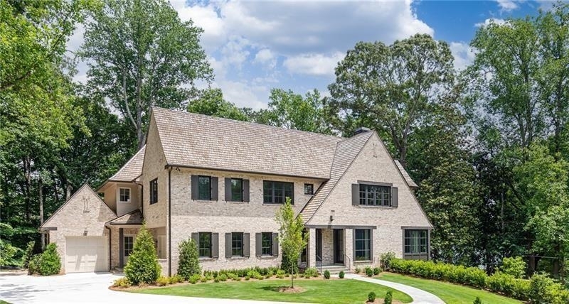Stunning custom Harrison Design new construction built by John Willis Custom Homes with Pool. Light-filled open floor plan where all the daily activities could take place on the main floor. Organic materials used throughout, like 7" white oak floors and exposed stained white pine trusses. Inviting Foyer with a metal front door, flanked by the Study with limestone surround fireplace and Dining Room. The kitchen features a center island w/ a sink and marble waterfall, marble countertops, custom cabinets, Metal window over the sink that easily opens to allow pass-through to the covered porch. Wolf/Subzero appliances and a walk-in pantry could serve as a prep area with extensive storage. 2- story Great Room with stunning exposed to the white pine trusses, limestone surround fireplace, and 3 sets of French doors leading to the covered porch. Master Suite on the main level with sitting room. Luxurious master bathroom with heated floors, double vanity, soaking tub, large shower, and walk-in closet. Upstairs boast 4 large en suite bedrooms. Covered porch with fireplace extends the living space, grilling terrace, pool site and private walk out main backyard. Butler's Pantry, 2 laundry rooms, 2 half baths, mudroom, front & rear stairs. Unfinished terrace level, plumbed for wet bar, and 2 full bath. Sought After location on quiet cul - de-sac- street. Minutes away from private schools, award winning public schools, Chastain Park, restaurants and shopping.