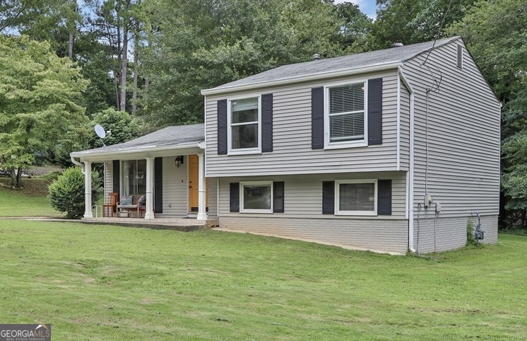 Welcome to 3542 Tewksbury Dr, Snellville, GA-a beautifully maintained 4-bedroom, 2-bath split-level home set on an expansive 0.45-acre lot in desirable Gwinnett County. From the moment you arrive, the covered front porch offers the perfect spot to unwind, adding charm and warmth to this inviting property. Step inside and you're welcomed into a bright, open main living area. The spacious living room flows seamlessly into the dining area and kitchen, offering a natural layout ideal for both daily living and entertaining. The kitchen stands out with sleek stainless steel appliances, providing a modern update that pairs beautifully with the home's original character. Upstairs, you'll find three well-appointed bedrooms, thoughtfully arranged to maximize privacy and functionality. The highlight is the fully renovated master bathroom, featuring modern finishes and a fresh, spa-like feel that adds a touch of luxury to your everyday routine. Head downstairs and discover the fourth bedroom, a versatile space perfect for guests, a home office, or a quiet retreat. Just around the corner, the spacious laundry room offers plenty of room for storage and utility, with potential to customize for added convenience. Step outside onto the private back deck, the perfect setting for morning coffee or evening gatherings. From there, take in the view of the open, level backyard-a wide, usable space ideal for gardening, pets, or outdoor play. With no rear neighbors, you'll enjoy exceptional privacy and potential to create your dream outdoor living area. Major systems have already been updated for your peace of mind, including a new exterior HVAC unit (2024) and a new water heater (2024), giving you reliable efficiency from day one. Located in a peaceful, established community with no HOA, this home gives you the freedom to live as you choose. It's also situated in the highly rated Gwinnett County School District (buyers encouraged to verify school assignments from reliable sources) and is just minutes from parks, shopping, dining, and major commuter routes. Don't miss your opportunity to own a well-cared-for home with smart updates, flexible living spaces, and room to grow. Schedule your private tour of 3542 Tewksbury Dr today!