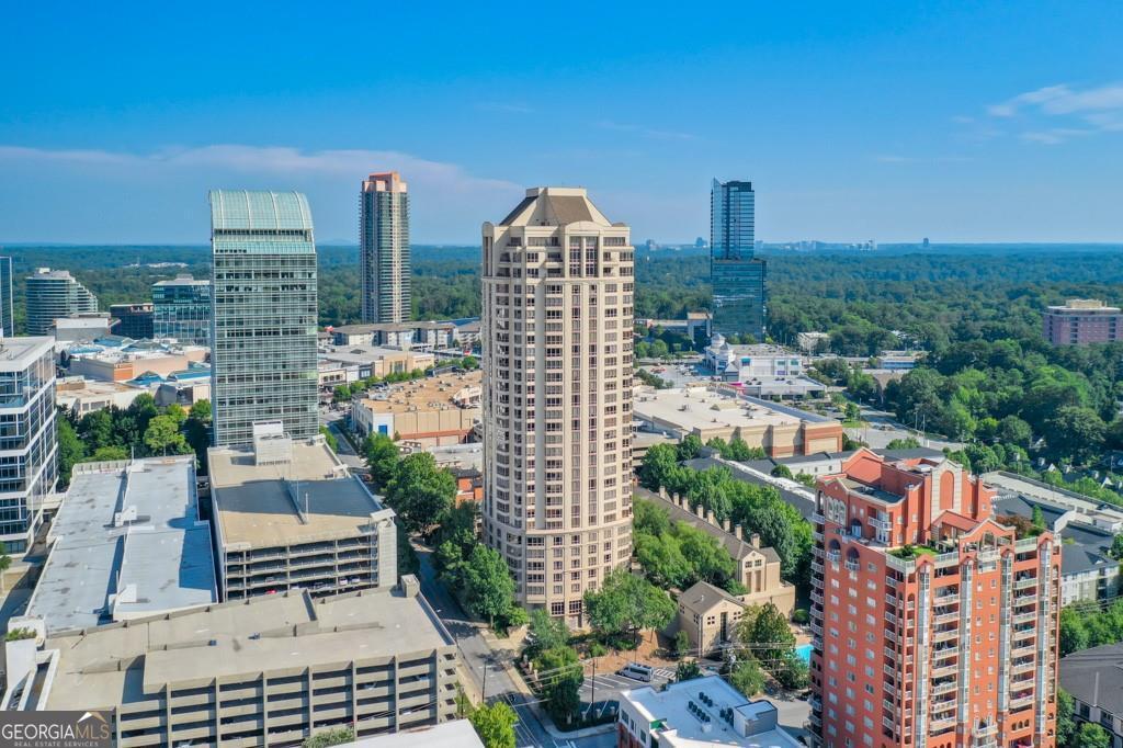 Stunning 2 Bedroom/ 2 Bath Condo with amazing views of Buckhead located on the 5th floor of The Oaks at Buckhead! Easy walk to Buckhead's finest shopping, dining, and services just steps away, less than one block to Publix & Target! Easy access to Marta and freeways for extended commutes. There is not a better Buckhead location! As you walk into this home you will immediately feel a sense of serenity, sophistication and luxurious style. Gorgeous bamboo flooring meets a panoramic view of the city with floor-to-ceiling glass windows. The generous great room is divided into 2 open living areas with tons of natural light. The primary suite features a walk in closet space with two master closets, and a chic quartz bathroom with oversized frameless glass shower. The secondary bedroom of this wing includes 2 additional custom closets with an ensuite bathroom, a full size laundry room conveniently located in the hall, and an abundant amount of custom built-in storage. Every box is checked in this home! Residents of The Oaks enjoy every possible amenity, including saline pool and jacuzzi, pristine fitness center, guest suite for friends or in-laws to stay, 24-hour concierge/ security, club room, business center, gorgeous courtyards, and secured parking garage.