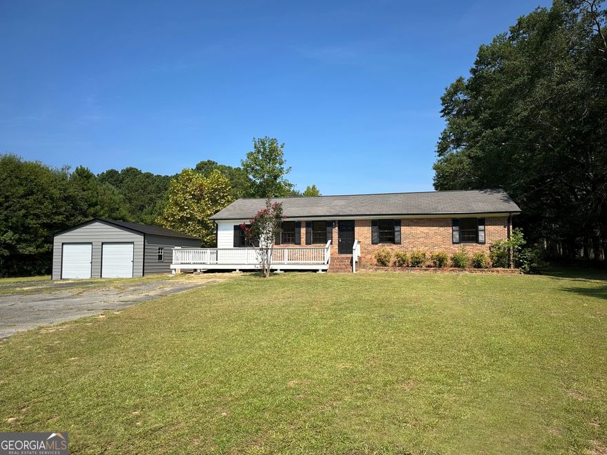 1000 Dixie Road is a 4 side brick ranch with 3 bedrooms and 2 bathrooms on a spacious 2.28 acre lot. Pergola on back porch overlooking large, level, private back yard. New metal two car garage. New front porch that wraps around to the side of the home. Newly renovated kitchen and bathrooms. Butcher block island in kitchen. New paint and flooring throughout the home. Bonus room off of kitchen with side entry. Wood burning fireplace in dining room. Only 10 minutes to downtown Covington, 15 minutes to I-20 and 45 minutes to Atlanta.