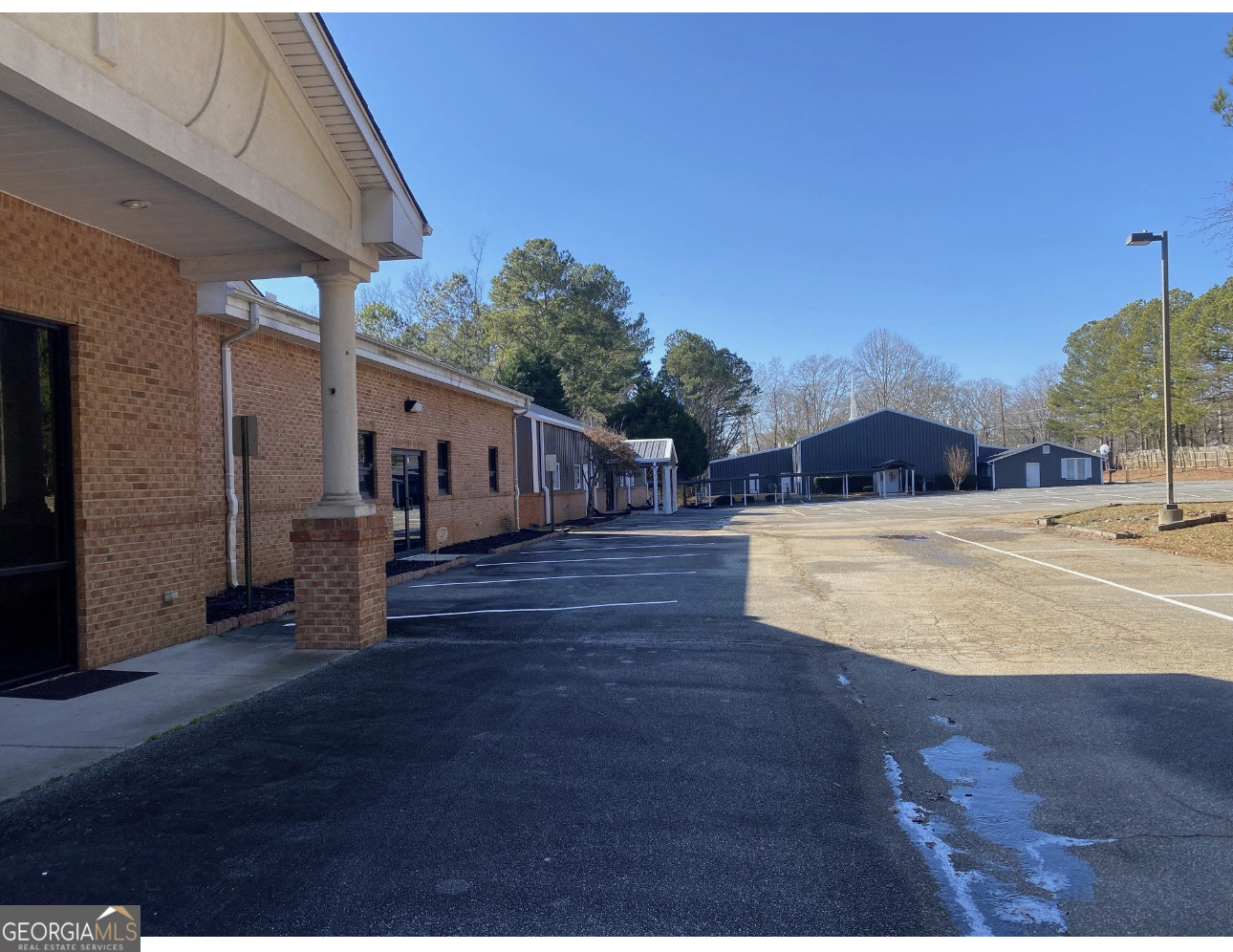 Prime Location of this 10,060-square foot brick building that was originally constructed to serve as a Youth Chapel and Educational Center. This building is part of a church complex off Holly Springs Road. Close in proximity to Sandy Plains Road, Shallowford, and Roswell Road. This is a mixed used building that has a chapel, band room, areas for day care space/kids room while worshipping. It has huge area for day care center at the end of the building. There are 11-12 office spaces that is perfect for other businesses. Owner is willing to split the building for church, day care center, and office spaces, subject to discussions. Owner reserve the right to sublease part of the the building for other usage. The overall usage can also be for youth recreation/leaning center, and a not profit organizations. Loads of potentials in this building, come see and expand your usage visualization. Another 1,392 sq ft office space is available to lease in the front of the building as well.